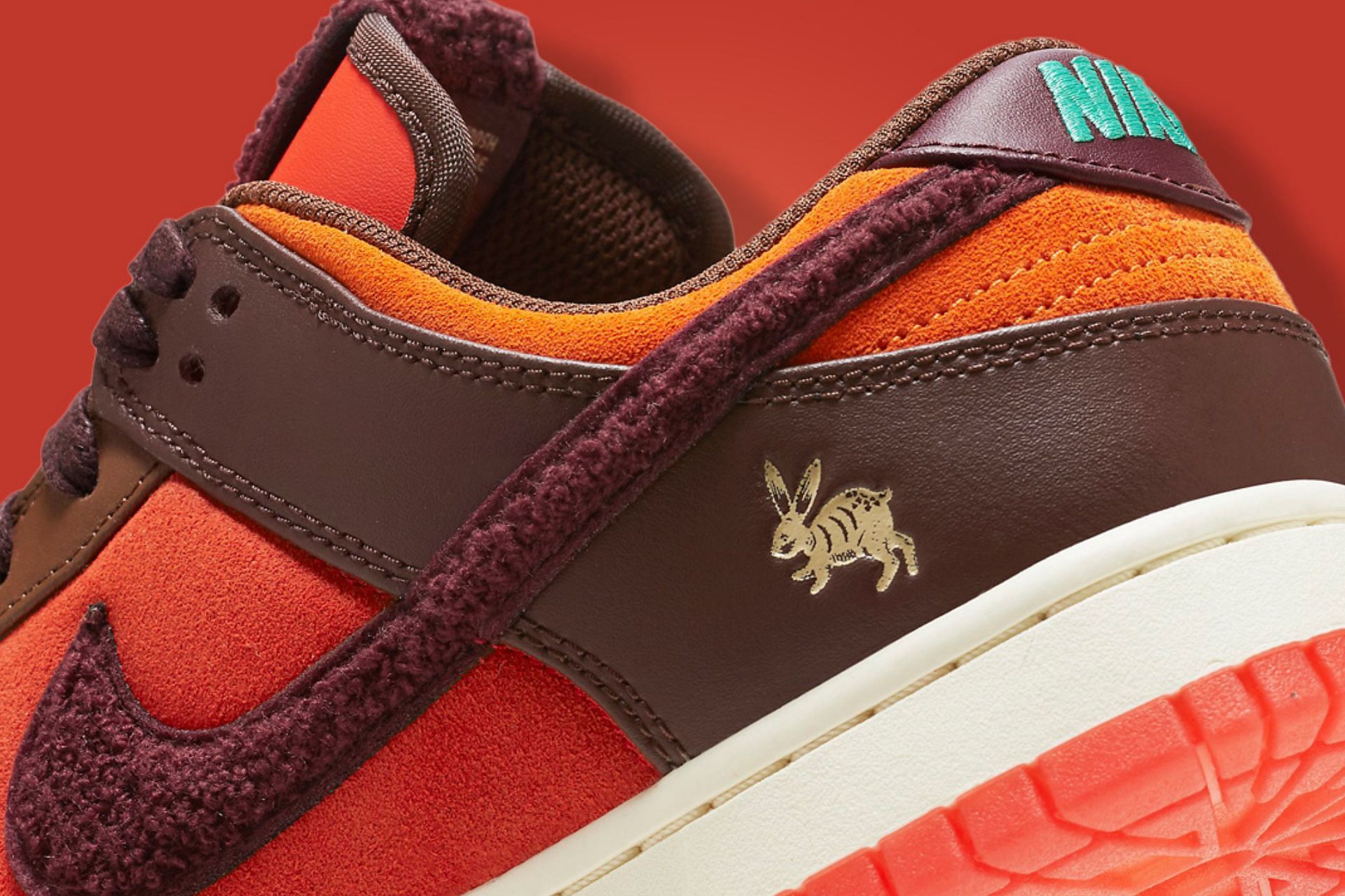The heel areas are embellished with the Chinese zodiac sign of these Nike Dunk Low (Image via Nike)