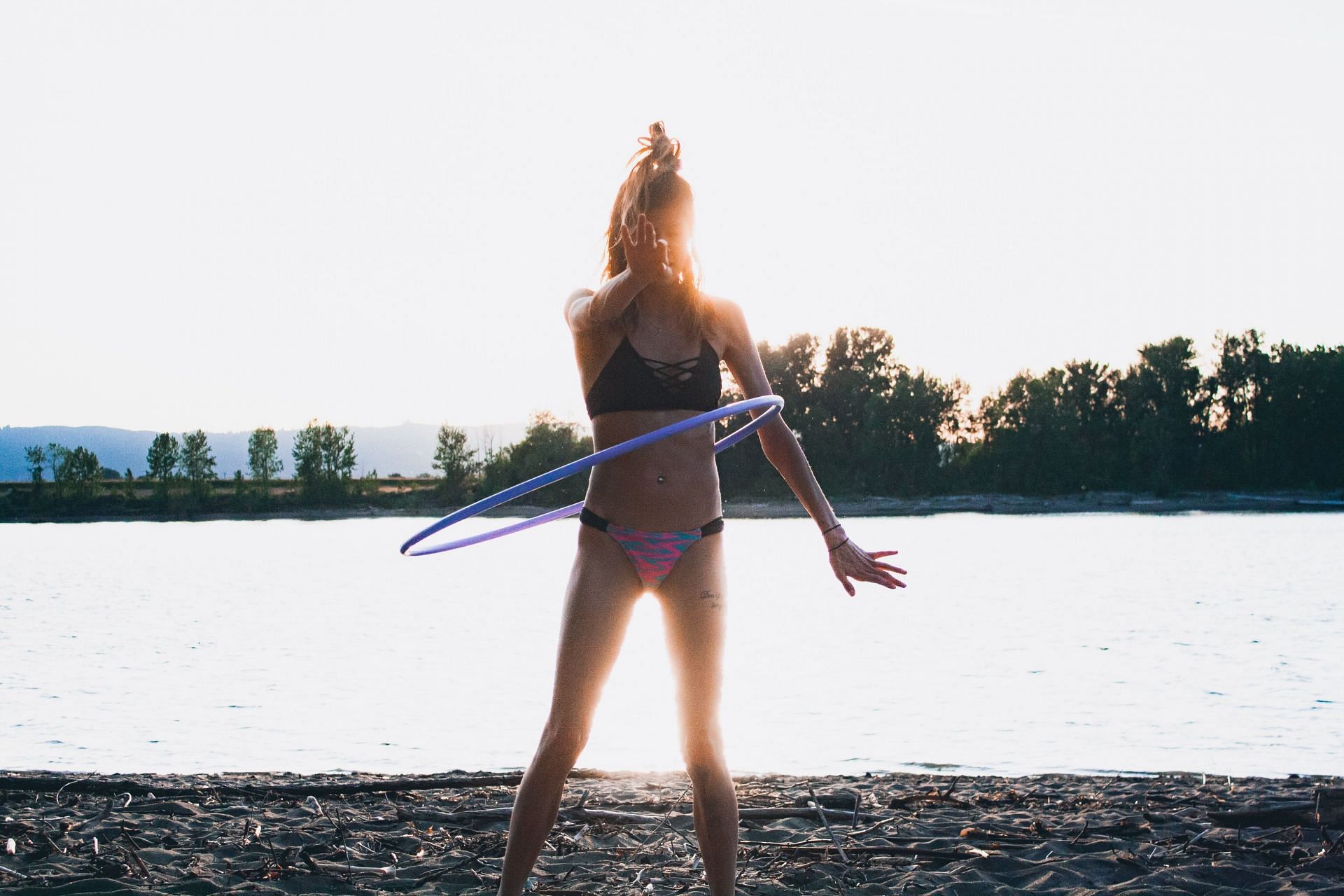 Hula hoop exercises are the best if you want to have fun while working out. (Image via Unsplash/ David Herron)