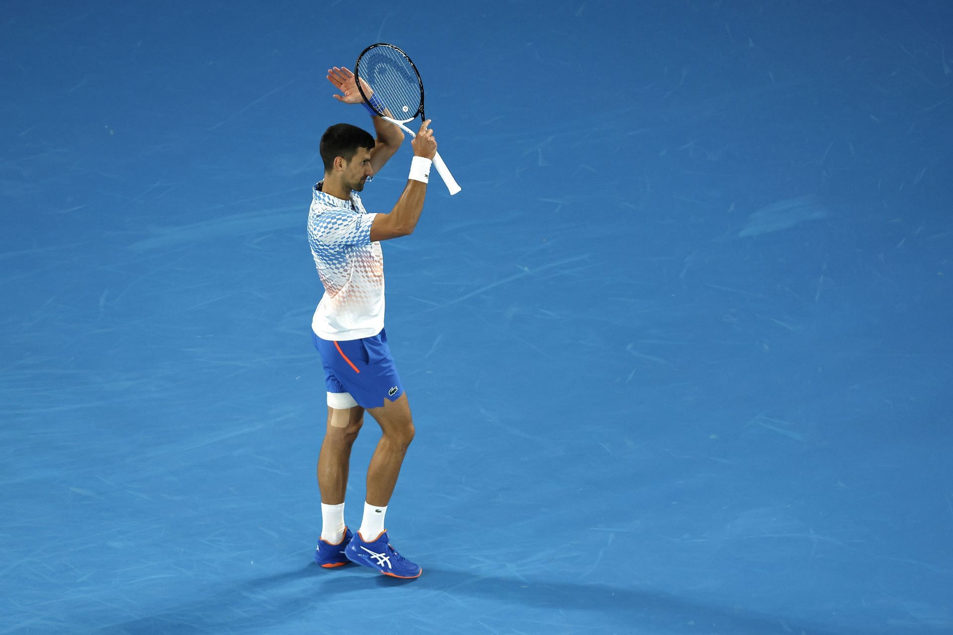 Novak Djokovic applauds the fans during the 2023 Australian Open