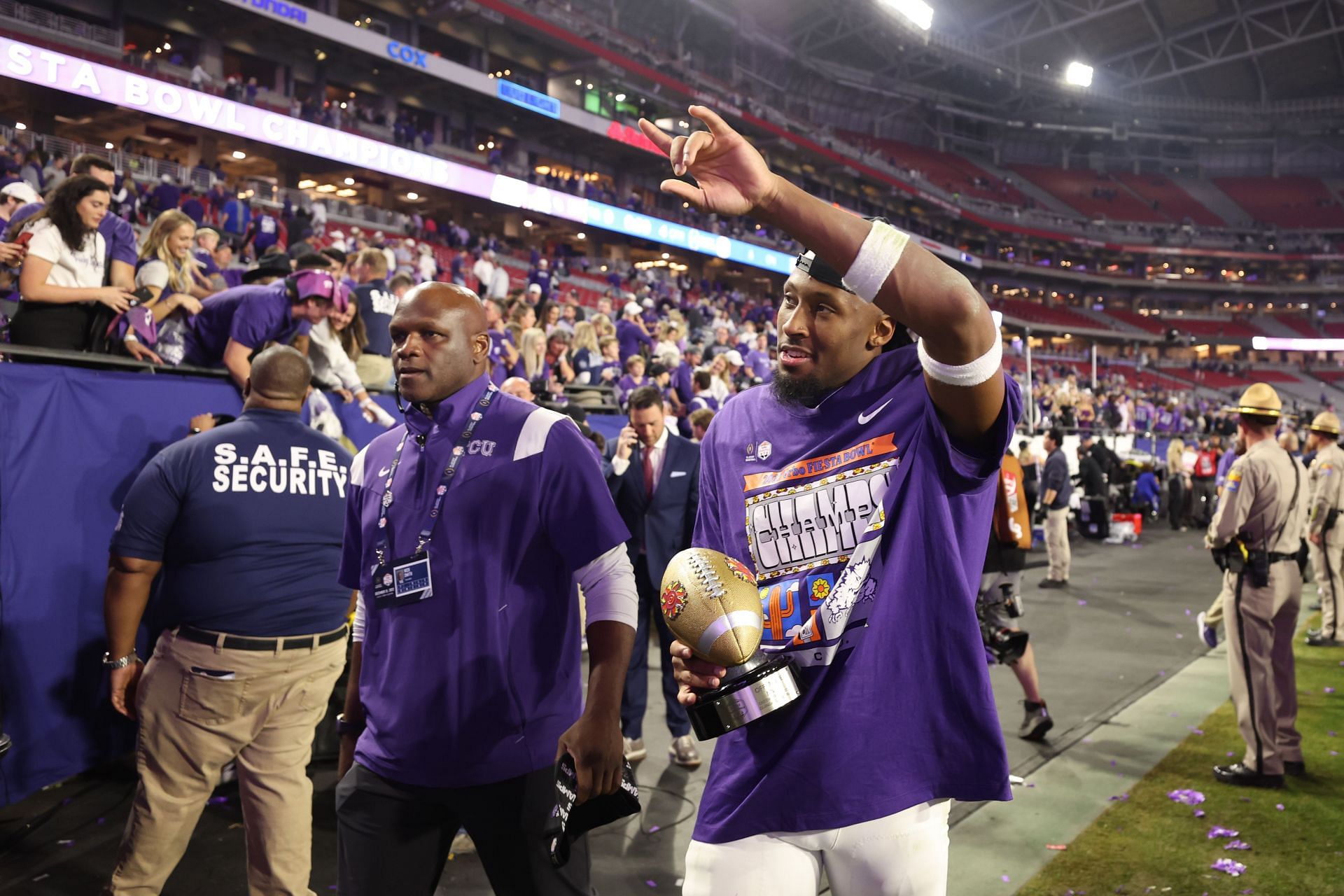 Quentin Johnston celebrates after defeating the Michigan Wolverines in the Vrbo Fiesta Bowl