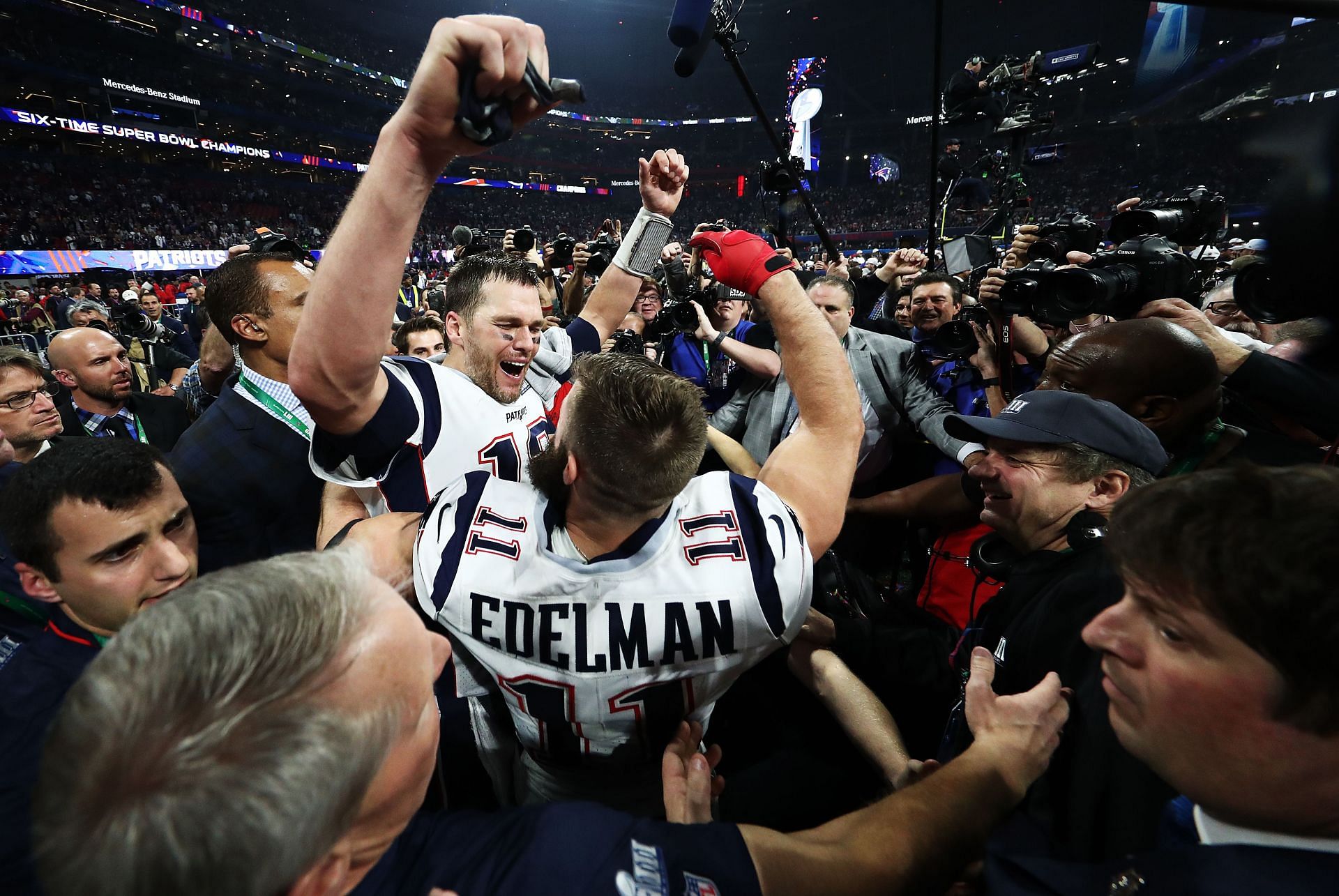 Tom Brady of the New England Patriots and Julian Edelman celebrate their team&#039;s 13-3 win over the Los Angeles Rams during Super Bowl LIII