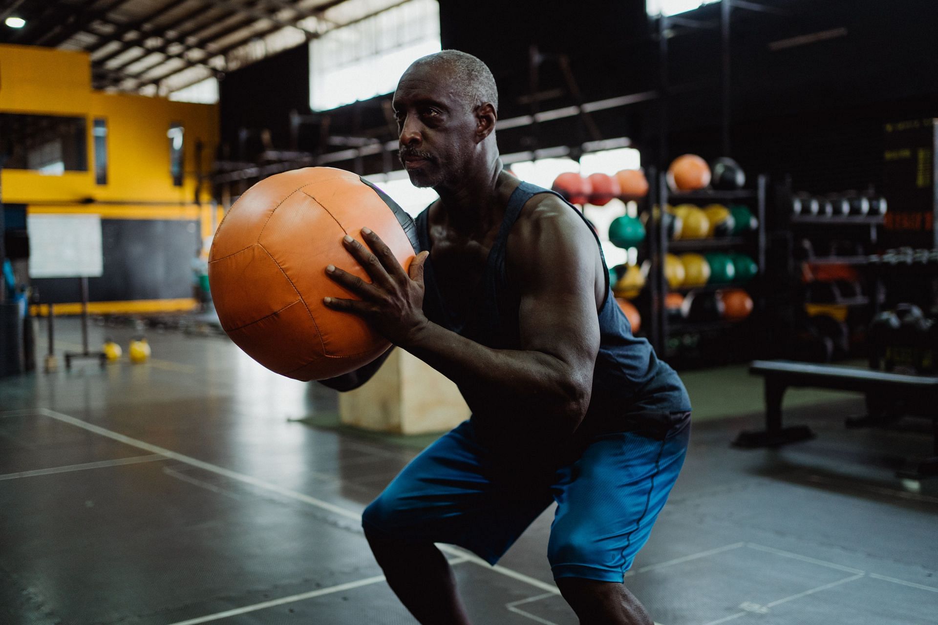 Medicine ball slams are one of the best ways to target your core. (Image via Pexels/Ketut Subiyanto)