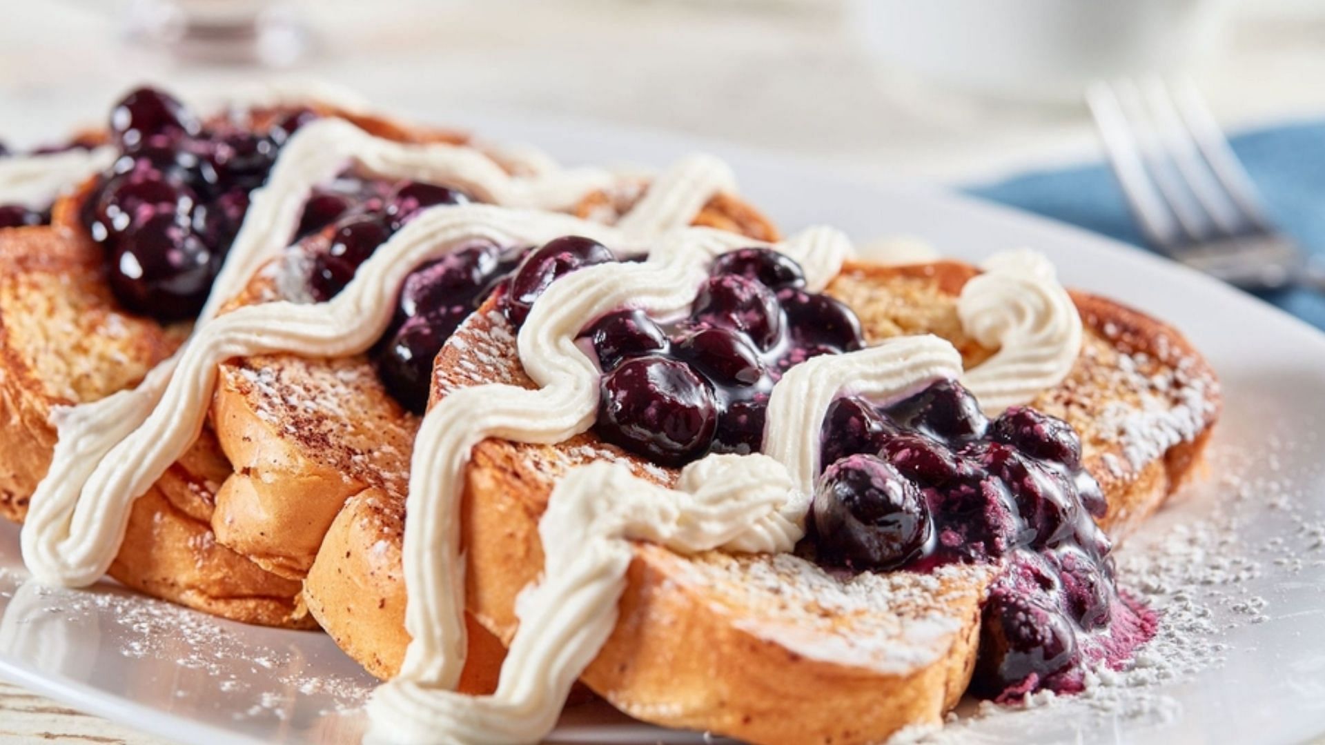 Huddle house&#039;s Blueberry Cheesecake Topped French Toast returns to the menu (Image via Huddle House)