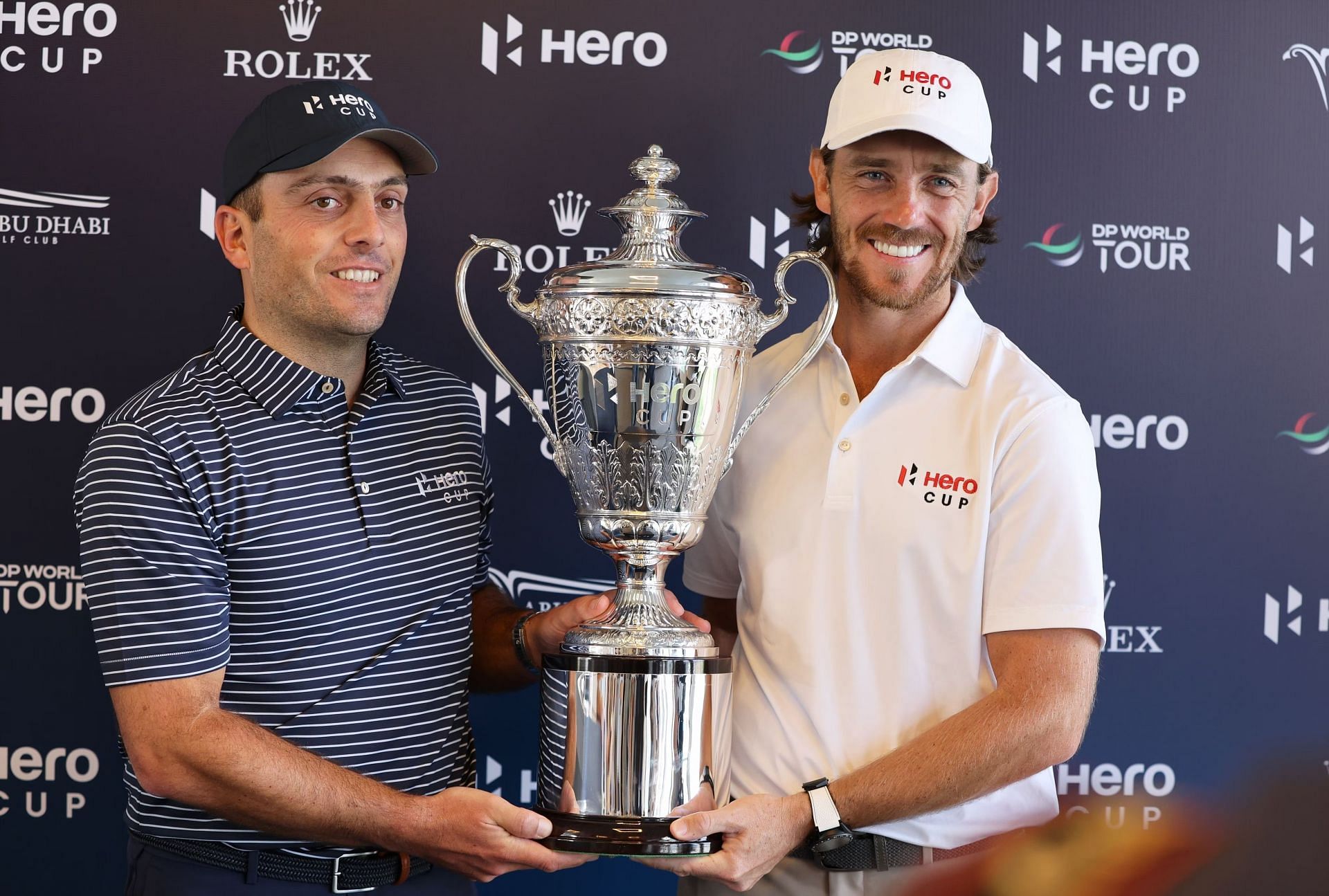 Francesco Molinari and Fleetwood pose with the Hero Cup trophy
