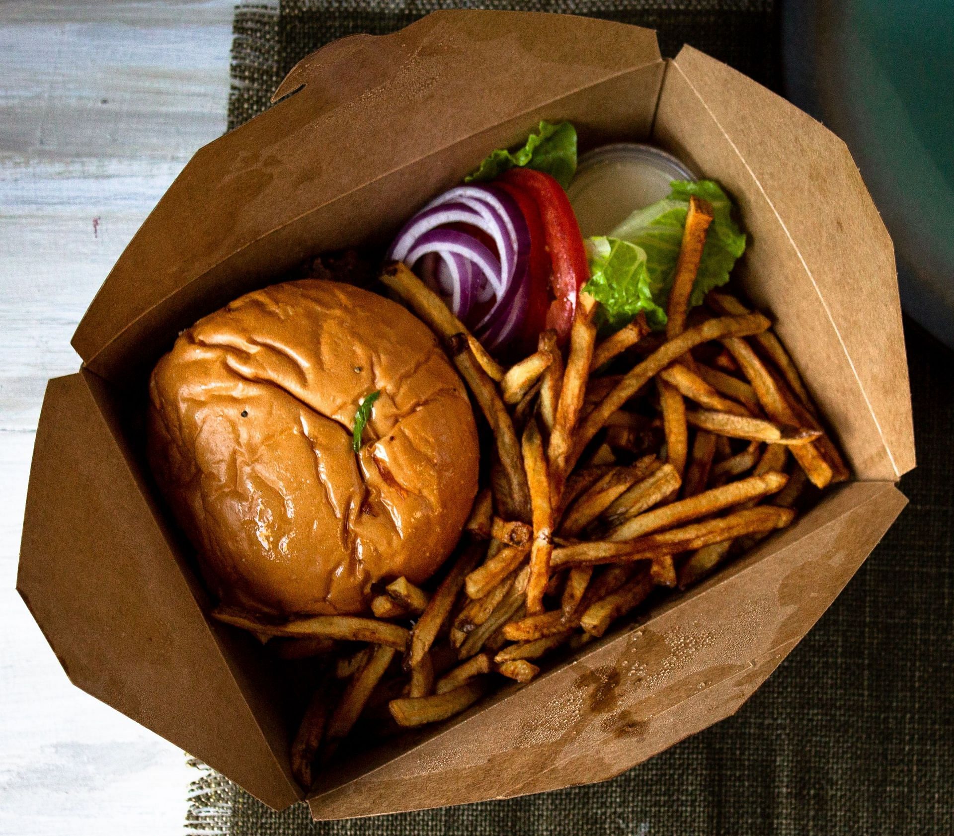 A greasy diet will likely contribute to greasy hair. (Image via Unsplash/Quin Engle)