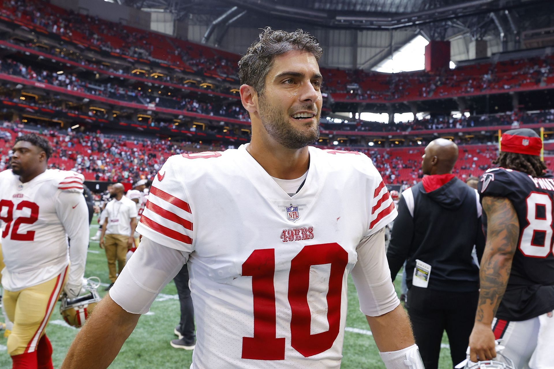 Jimmy Garoppolo of the San Francisco 49ers walks off the field after his team&#039;s 28-14 loss against the Atlanta Falcons