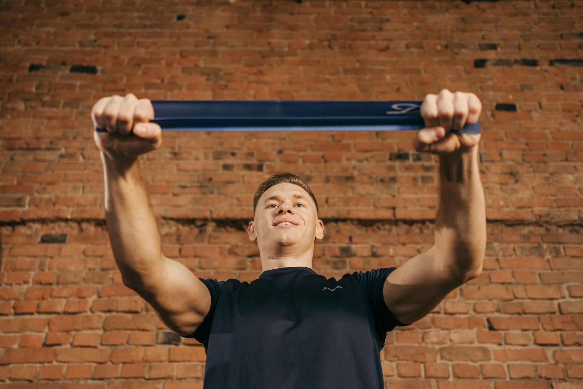 Banded pull-aparts are one of the best resistance band shoulder exercises for you to try! (Image via pexels/Pavel Danilyuk)