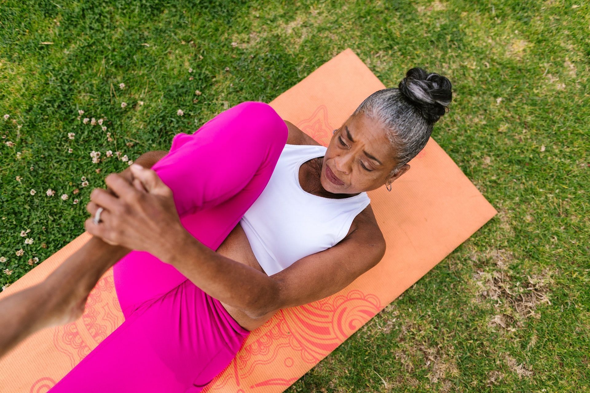 Knee-to-chest is good for the lower back muscles. (Photo via Pexels/Photo by RODNAE Productions)