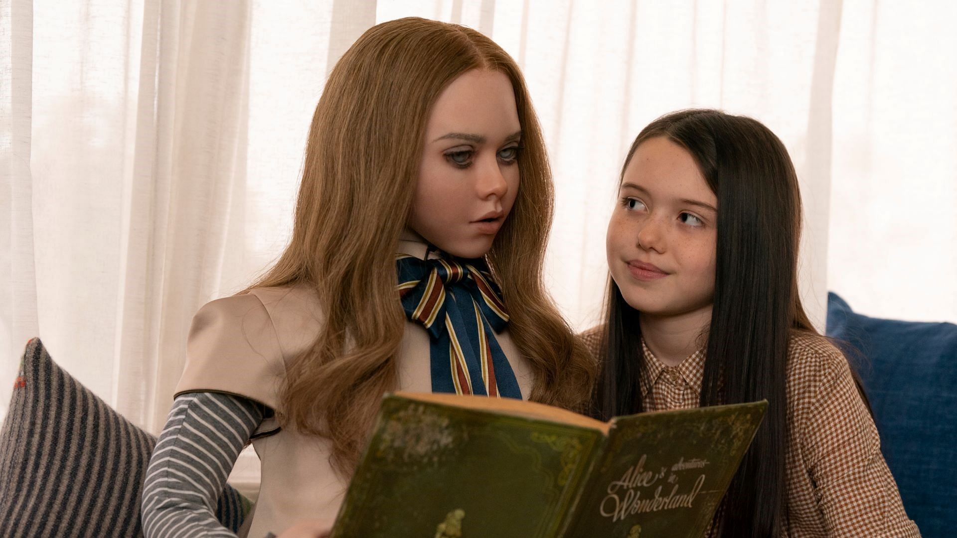 M3GAN and Cady, played by Amie Donald/Jenna Davis and Violet McGraw, respectively (Image via Blumhouse Productions/Universal Pictures)