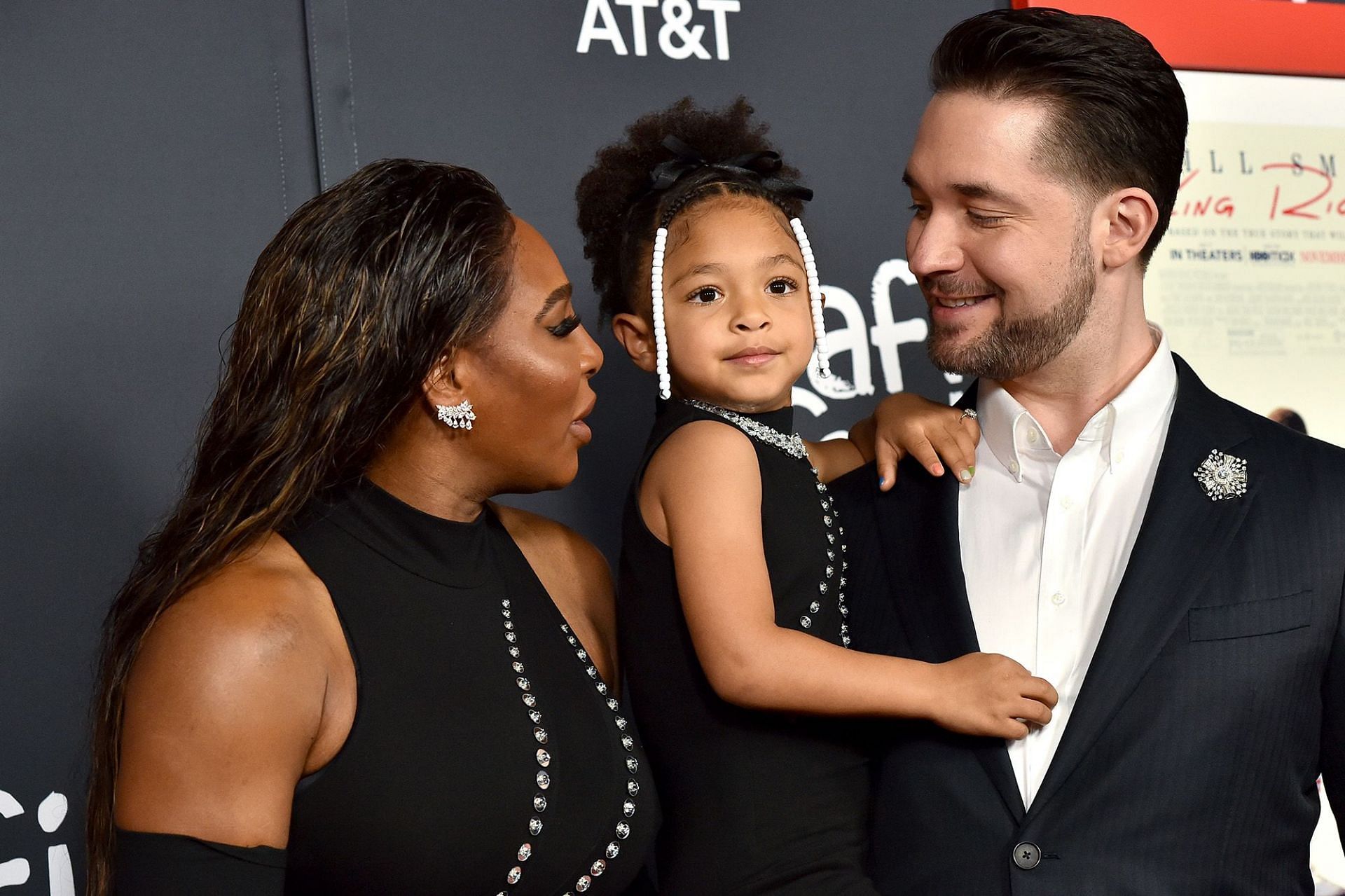 Serena Williams pictured with her husband and daughter