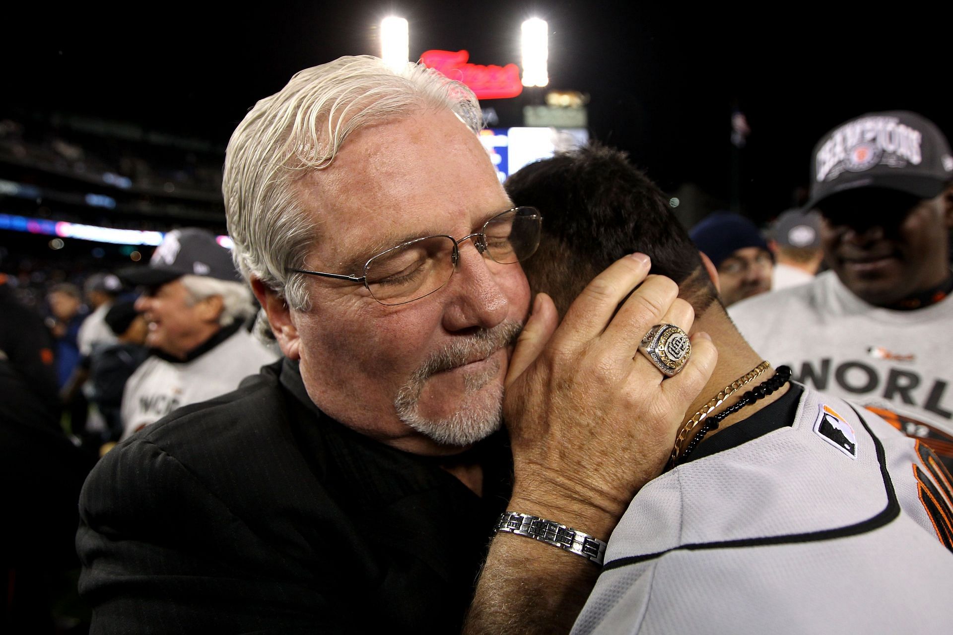 Senior Vice President and General Manager Brian Sabean of the San Francisco Giants celebrates with Sergio Romo #54 after the Giants defeat the Detroit Tigers to win the World Series