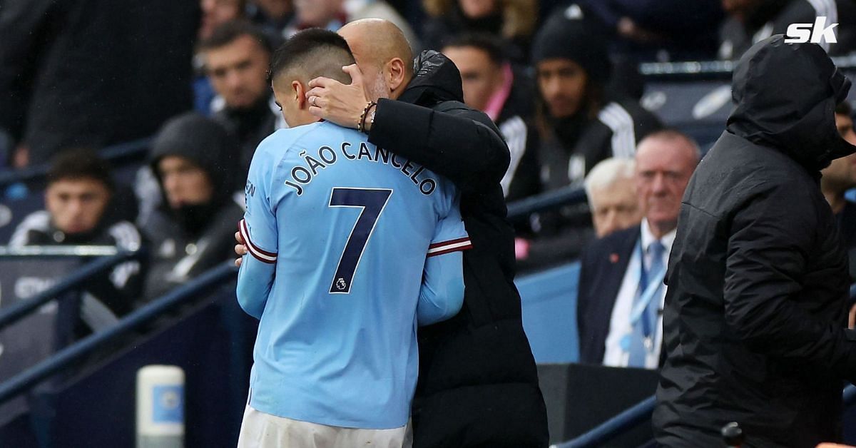 Guardiola having a word with Cancelo of Manchester City
