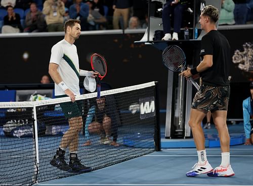 Andy Murray shakes hands at the net after his five-set victory in their round two singles match against Thanasi Kokkinakis