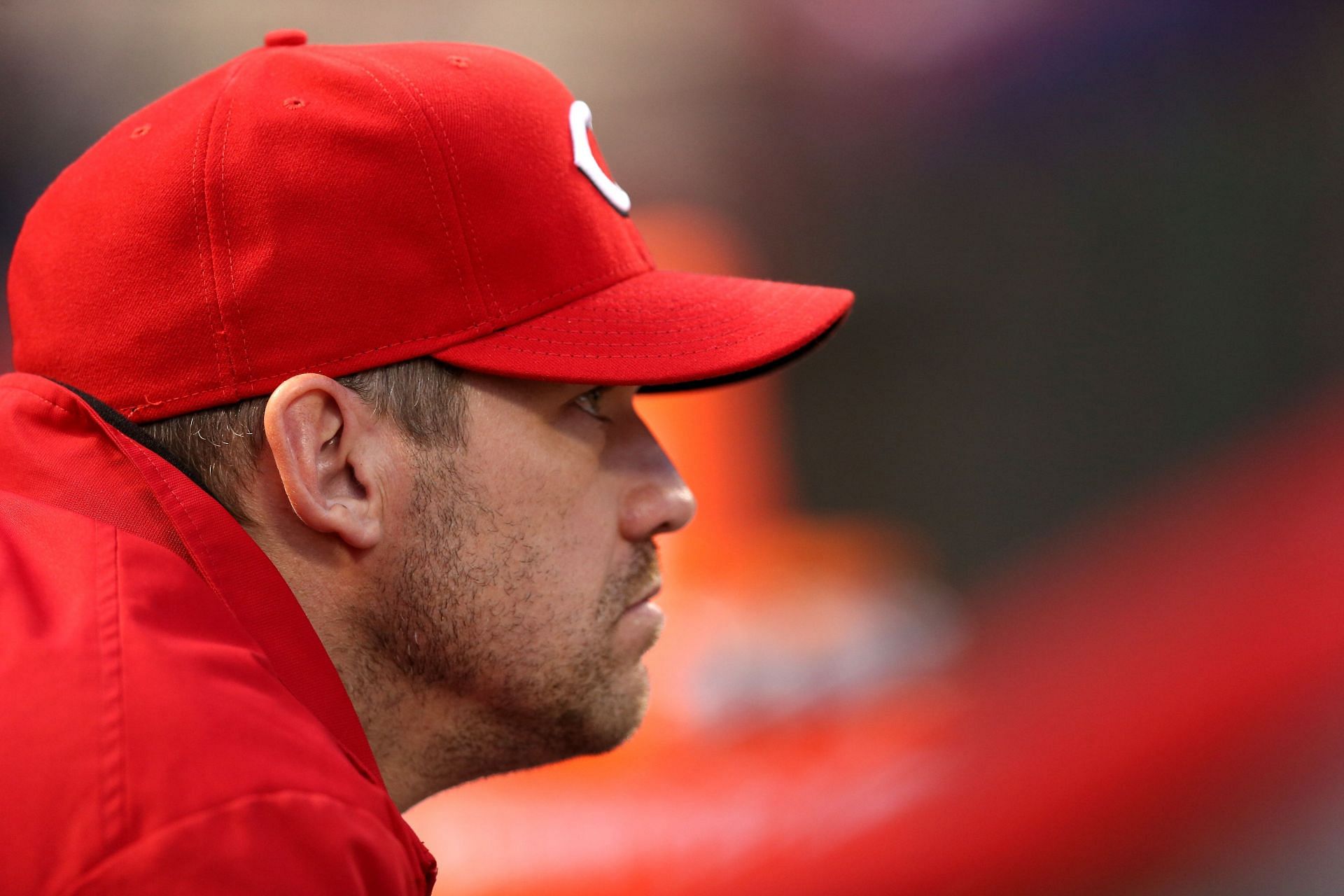 Scott Rolen watches from the dugout against the San Francisco Giants at the Great American Ball Park