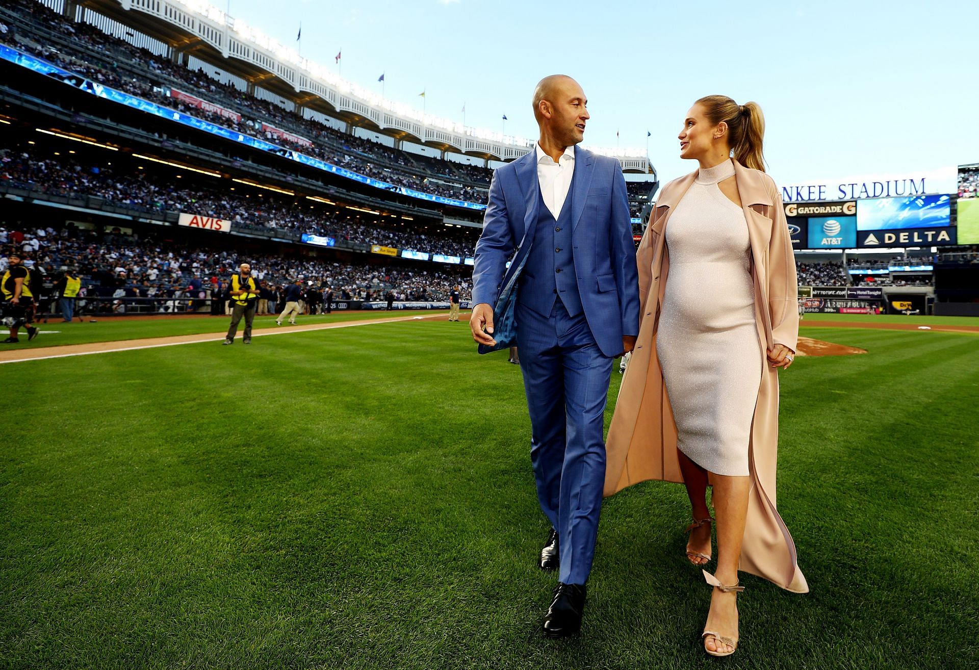 Hannah Davis watches New York Yankees Derek Jeter walks around on the field  after he hit a walk off game winning single in the bottom of the 9th inning  against the Baltimore