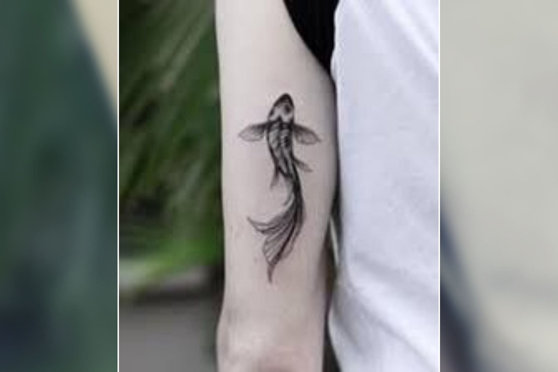 Aesthetic yet symbolic koi fish tattoo for men (Image via Sportskeeda)