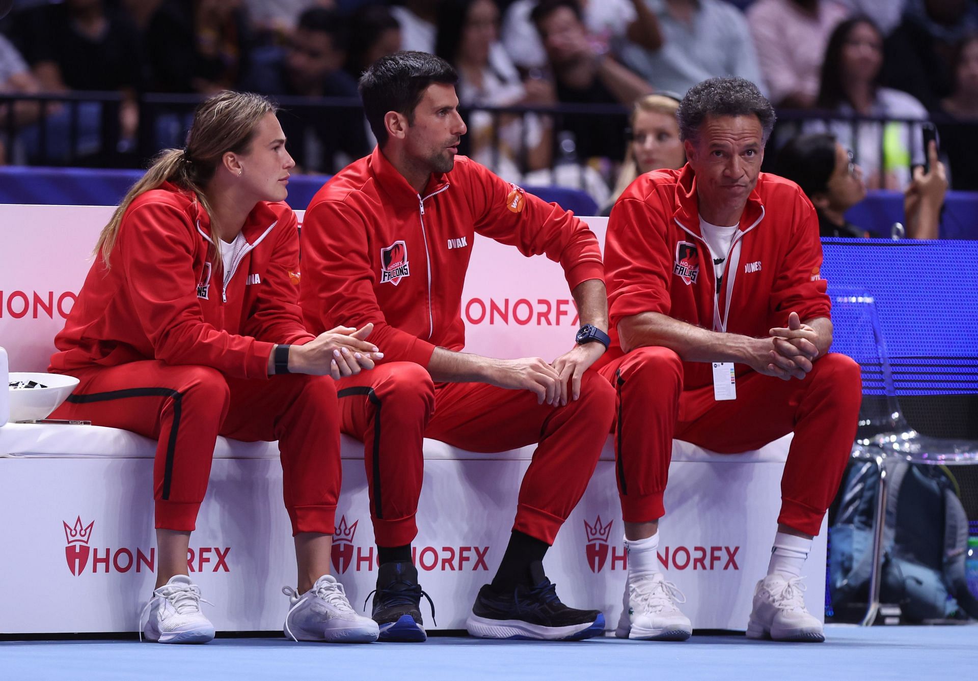Novak Djokovic and Aryna Sabalenka on the Team Falcons bench at the 2022 World Tennis League.