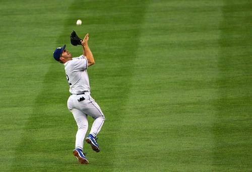 Secondbaseman Jeff Kent #12 of the Los Angeles Dodgers makes an over the shoulder catch on a pop up by Dustan Mohr of the Colorado Rockies at Coors Field on July 5, 2005 in Denver, Colorado.