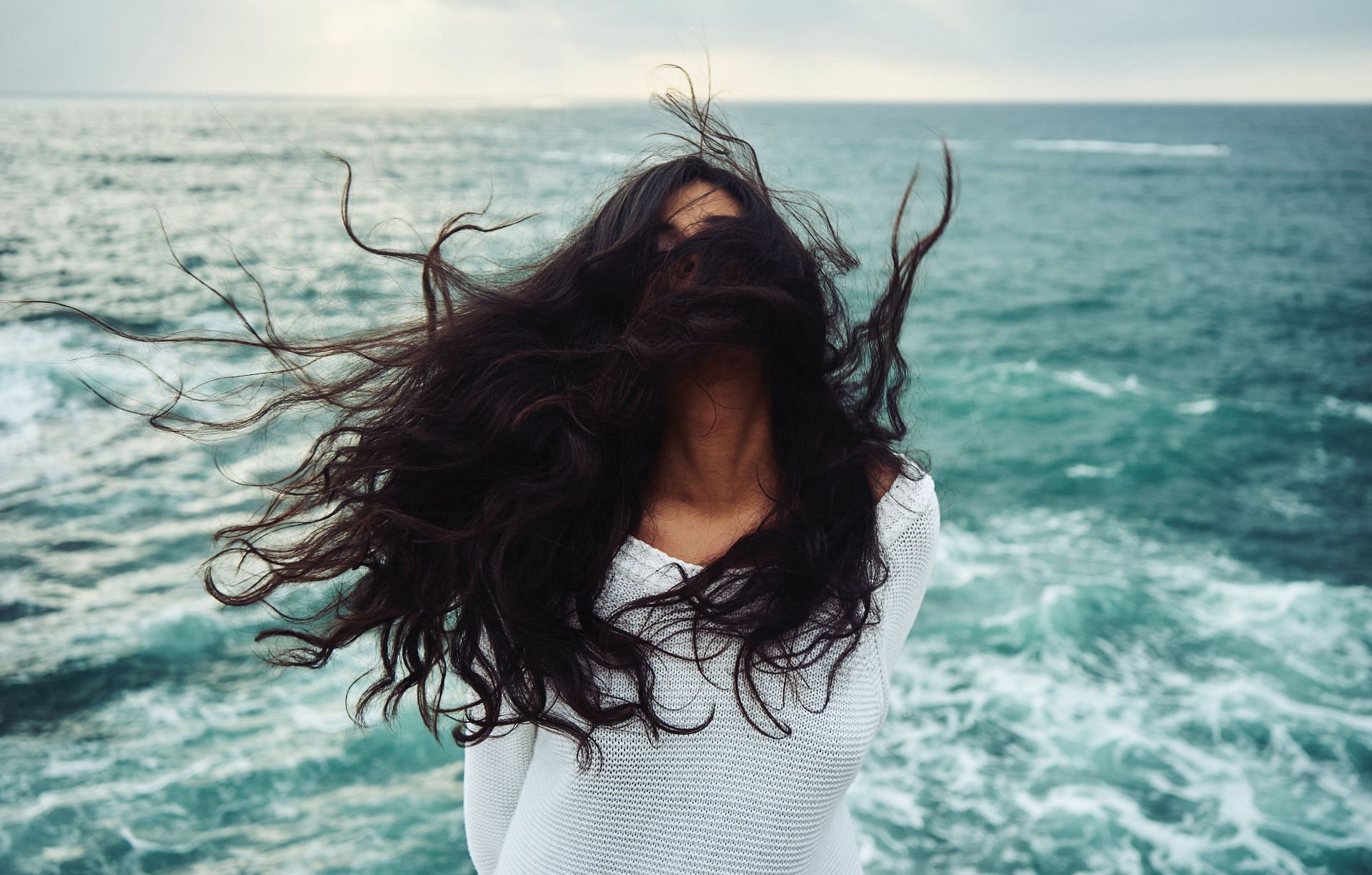 Avoid products with sulfates for healthy hair. (Image via Unsplash/ Yoann Boyer)