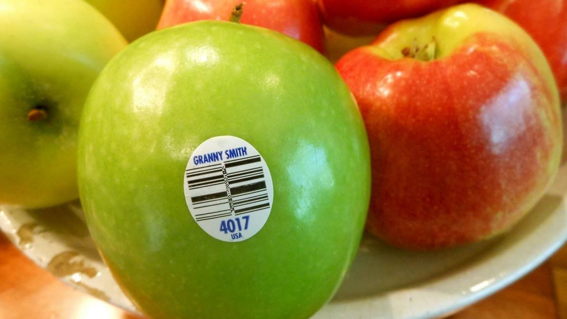 Shopping trick explained on TikTok through sticker codes on card fruits (Image via Shutterstock)