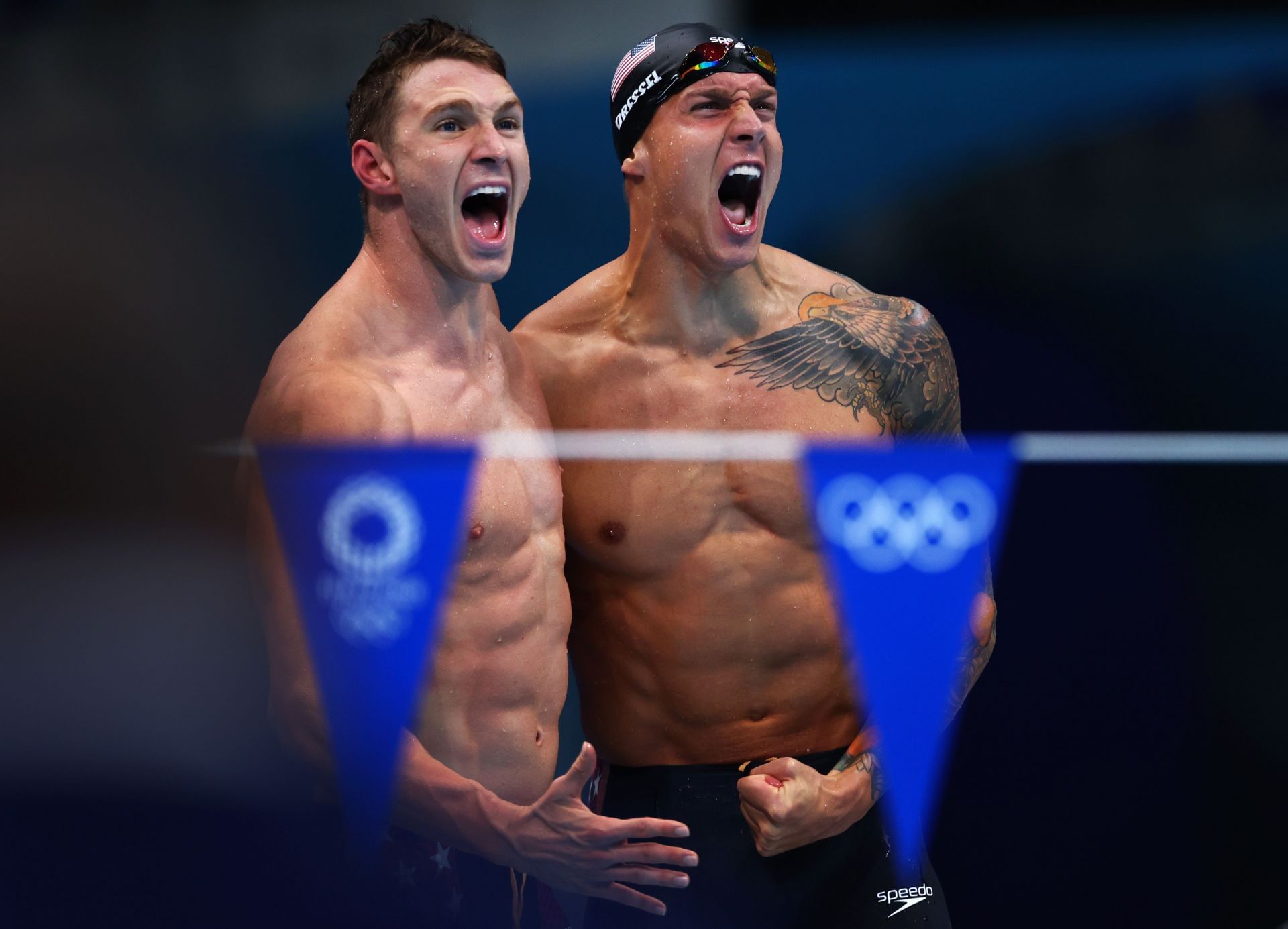 Ryan Murphy (L) and Caeleb Dressel (R) of Team United States react after winning the gold medal (Photo by Maddie Meyer/Getty Images)