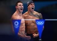 Ryan Murphy (L) and Caeleb Dressel (R) of Team United States react after winning the gold medal (Photo by Maddie Meyer/Getty Images)