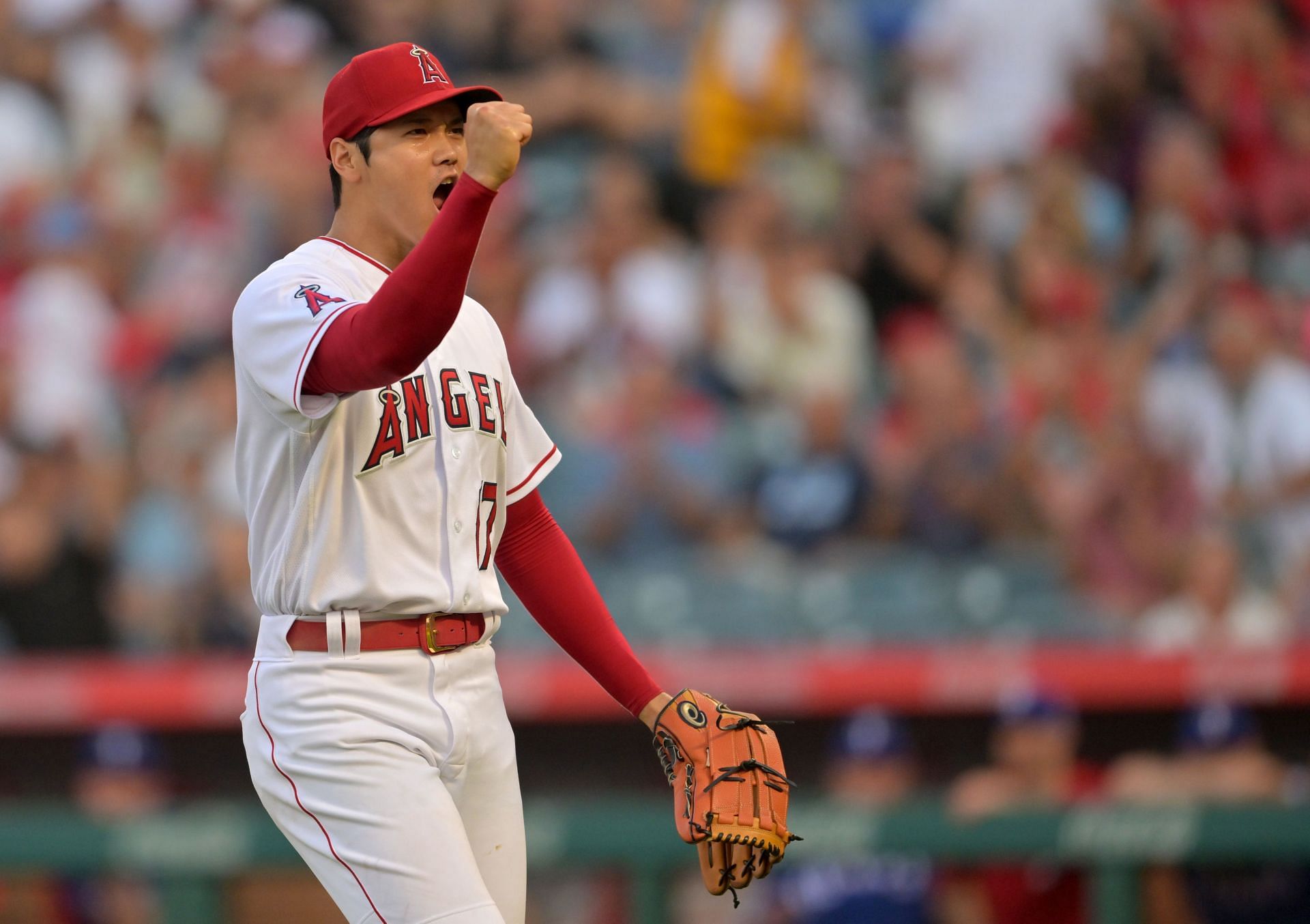 Shohei Ohtani #17 of the Los Angeles Angels reacts after pitching out of a bases loaded jam in the first inning against the Texas Rangers at Angel Stadium of Anaheim on July 28, 2022 in Anaheim, California.