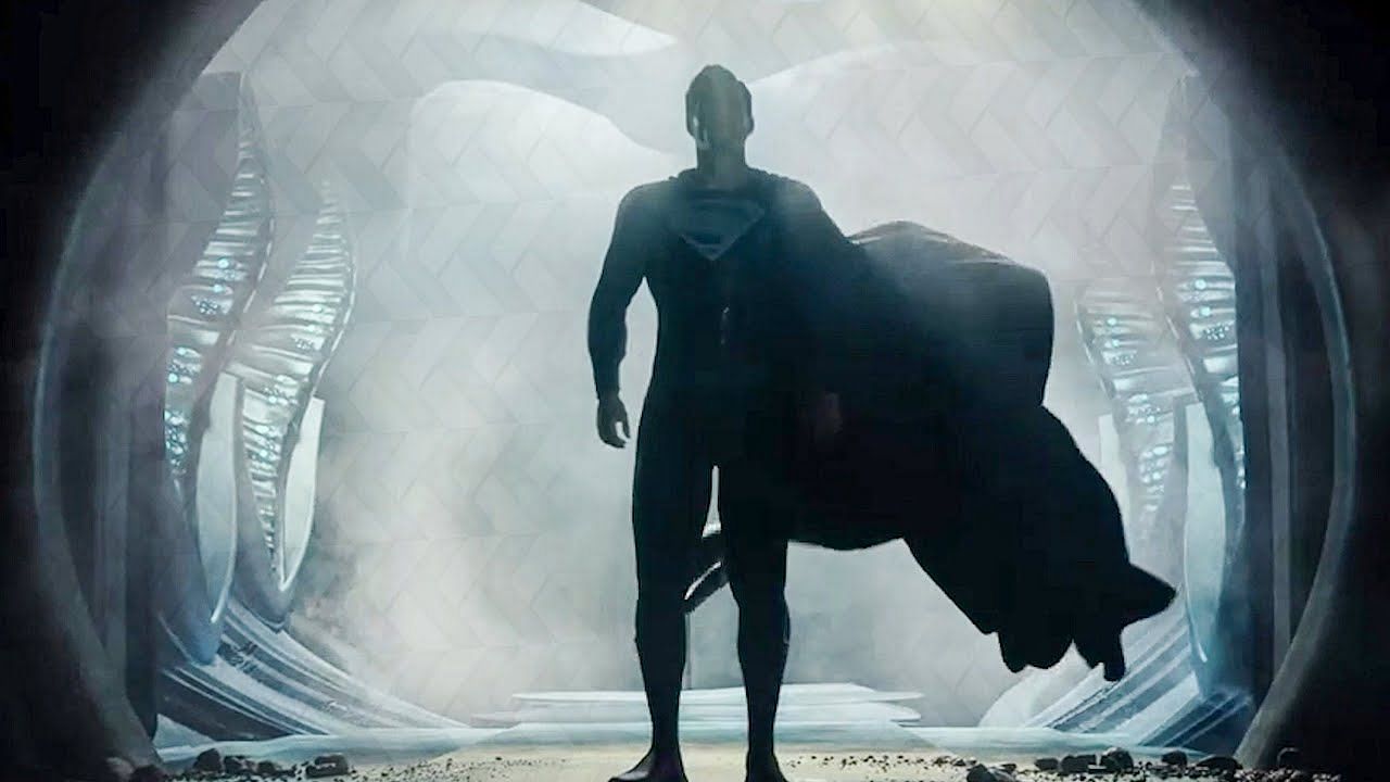 Superman, donning the iconic black suit, stands ready to face off against his foes, the suit made famous from his resurrection in the comics. (Image via Warner Bros)