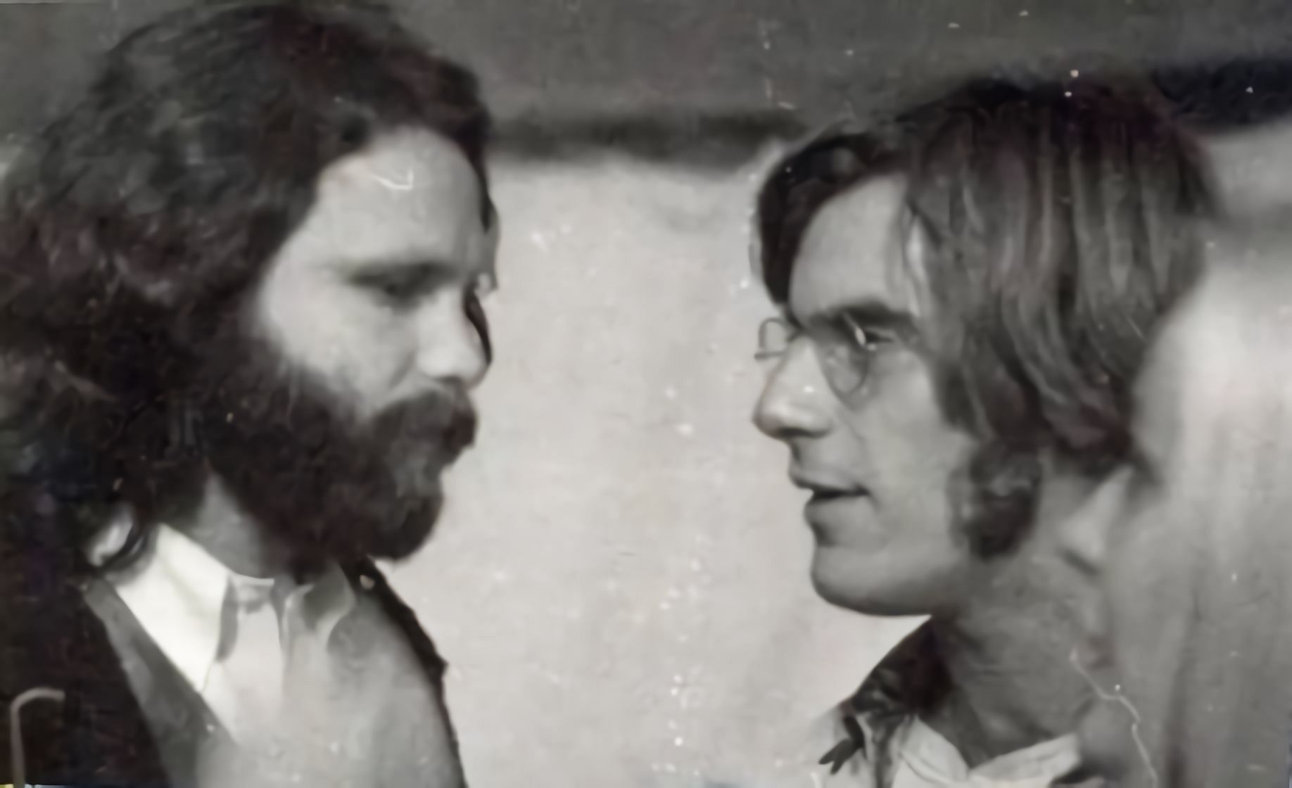 Jim Morrison with John Sebastian (Image via Tumblr)