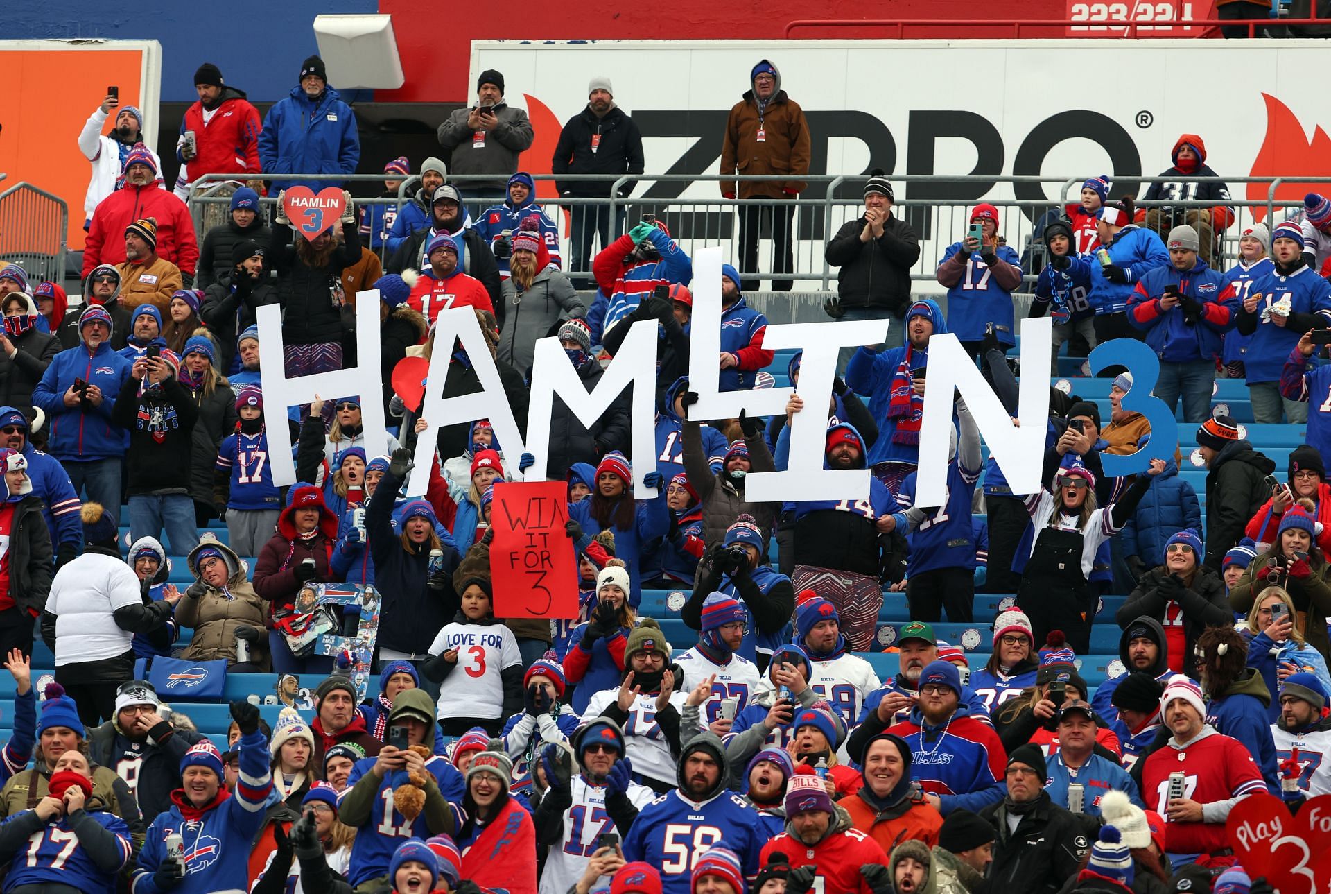 NFL fans holding up Hamlin name