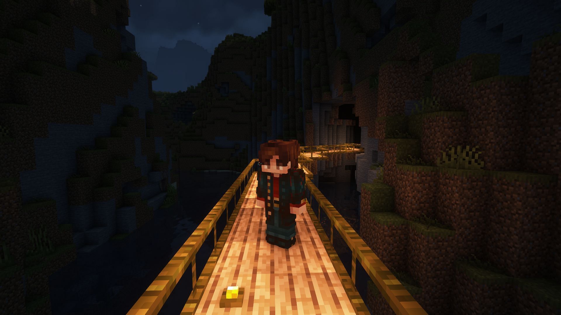 A simple jungle bridge leading into a cave opening (Image via Mojang)