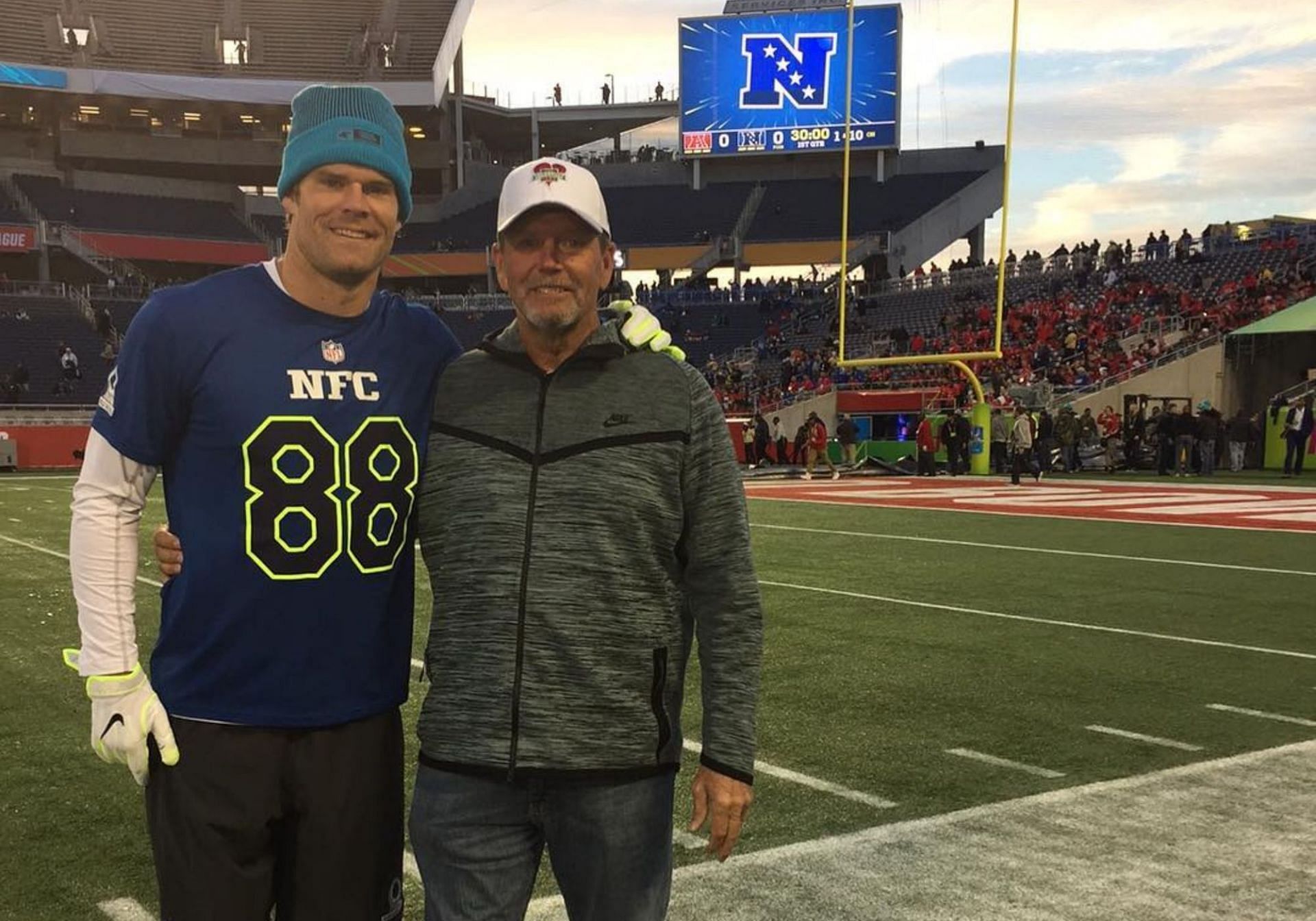Greg Olsen with his father Chris
