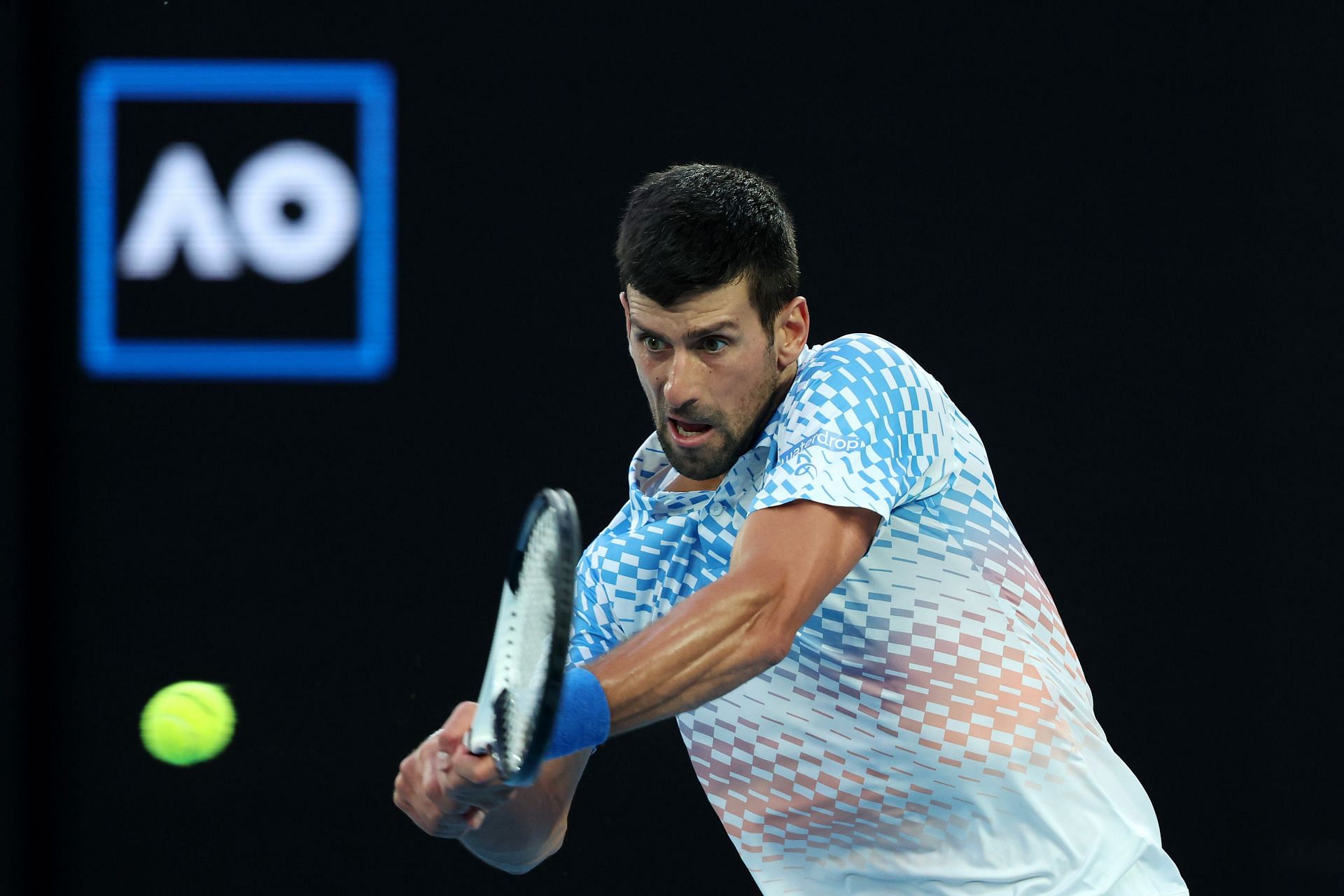 Novak Djokovic plays a backhand in the Quarterfinal singles match against Andrey Rublev
