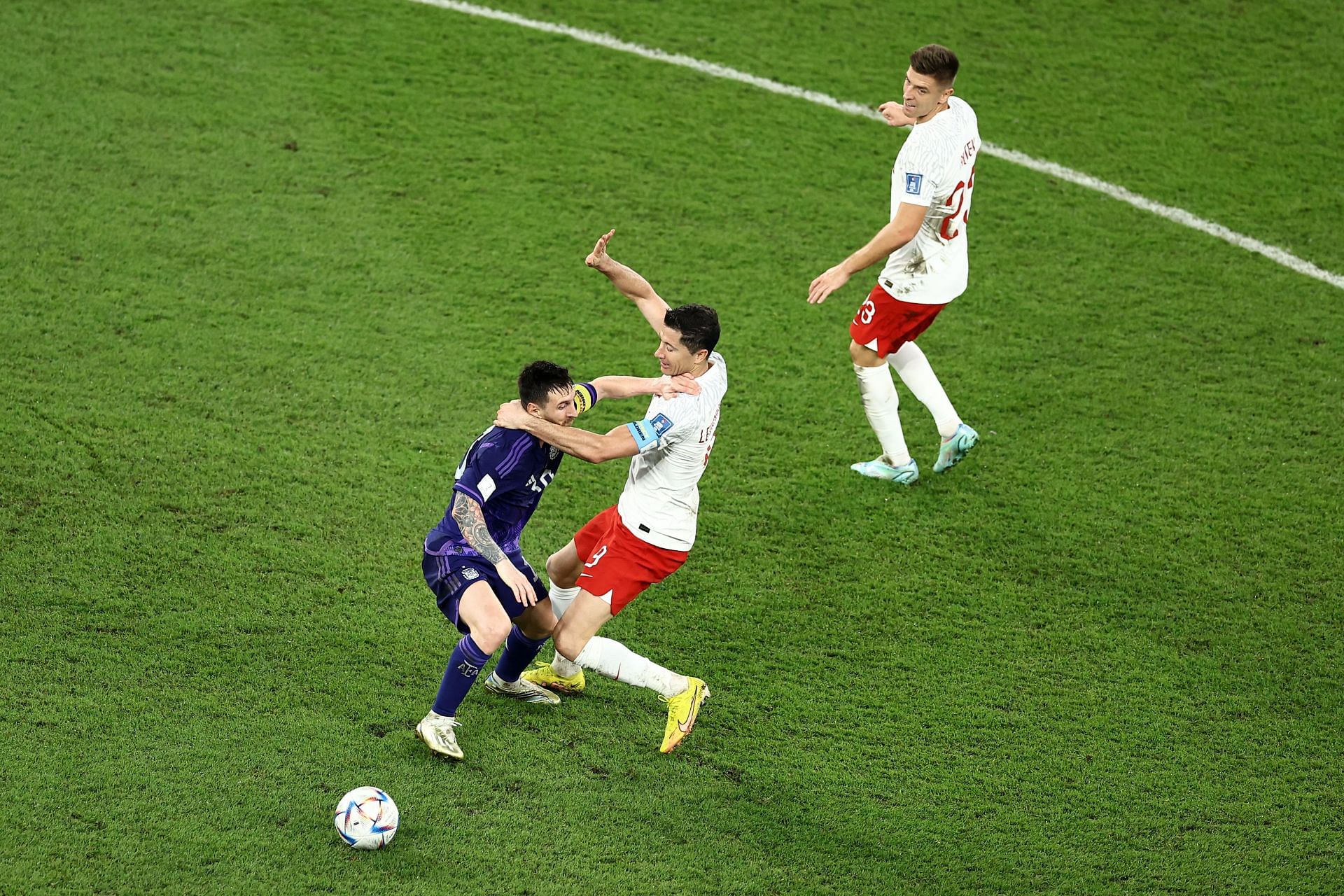 Lionel Messi and Robert Lewandowski facing each other at the World Cup