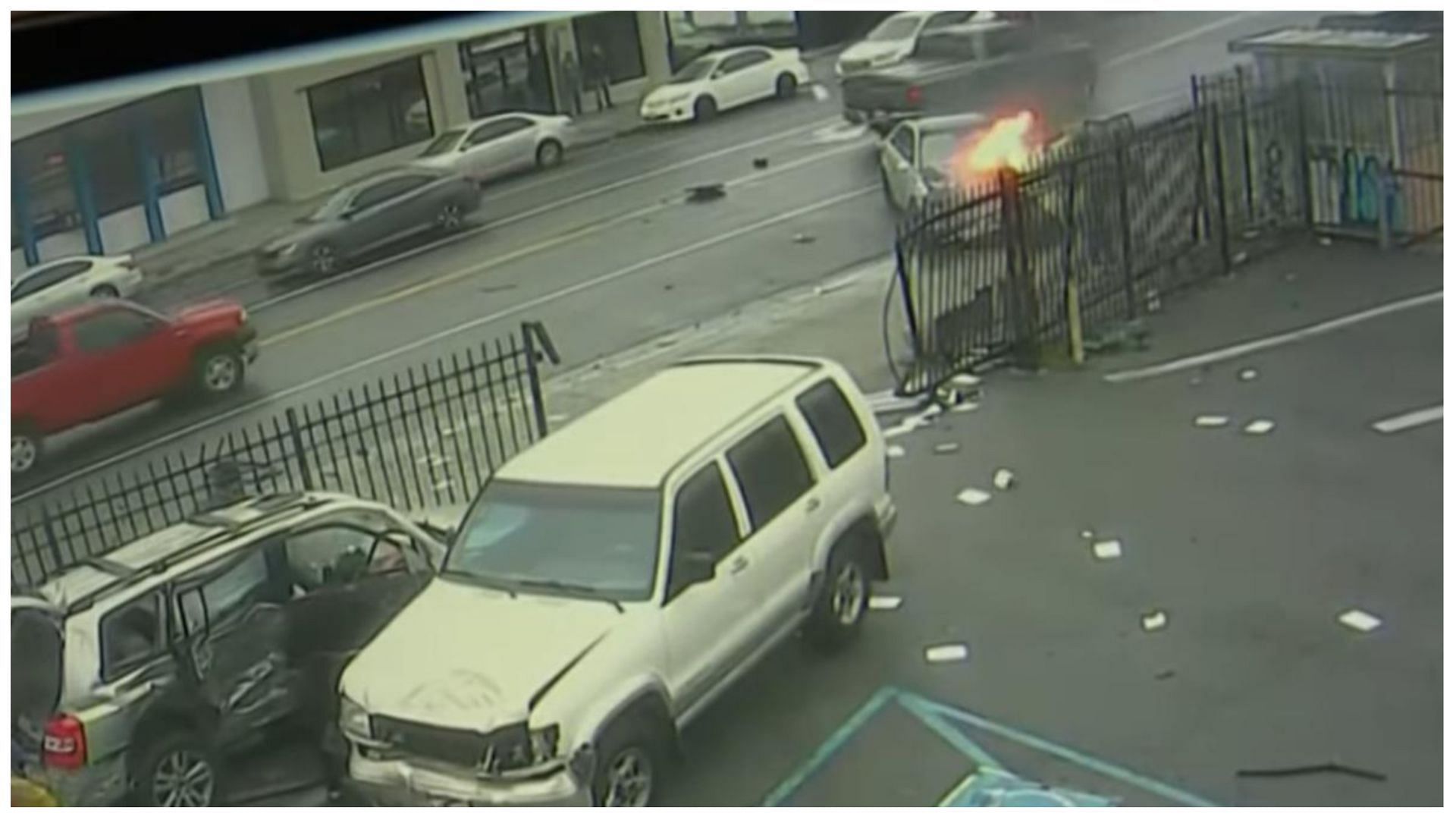 The Mercedes Sedan caught fire after the crash. (Image via KCAL News/YouTube)