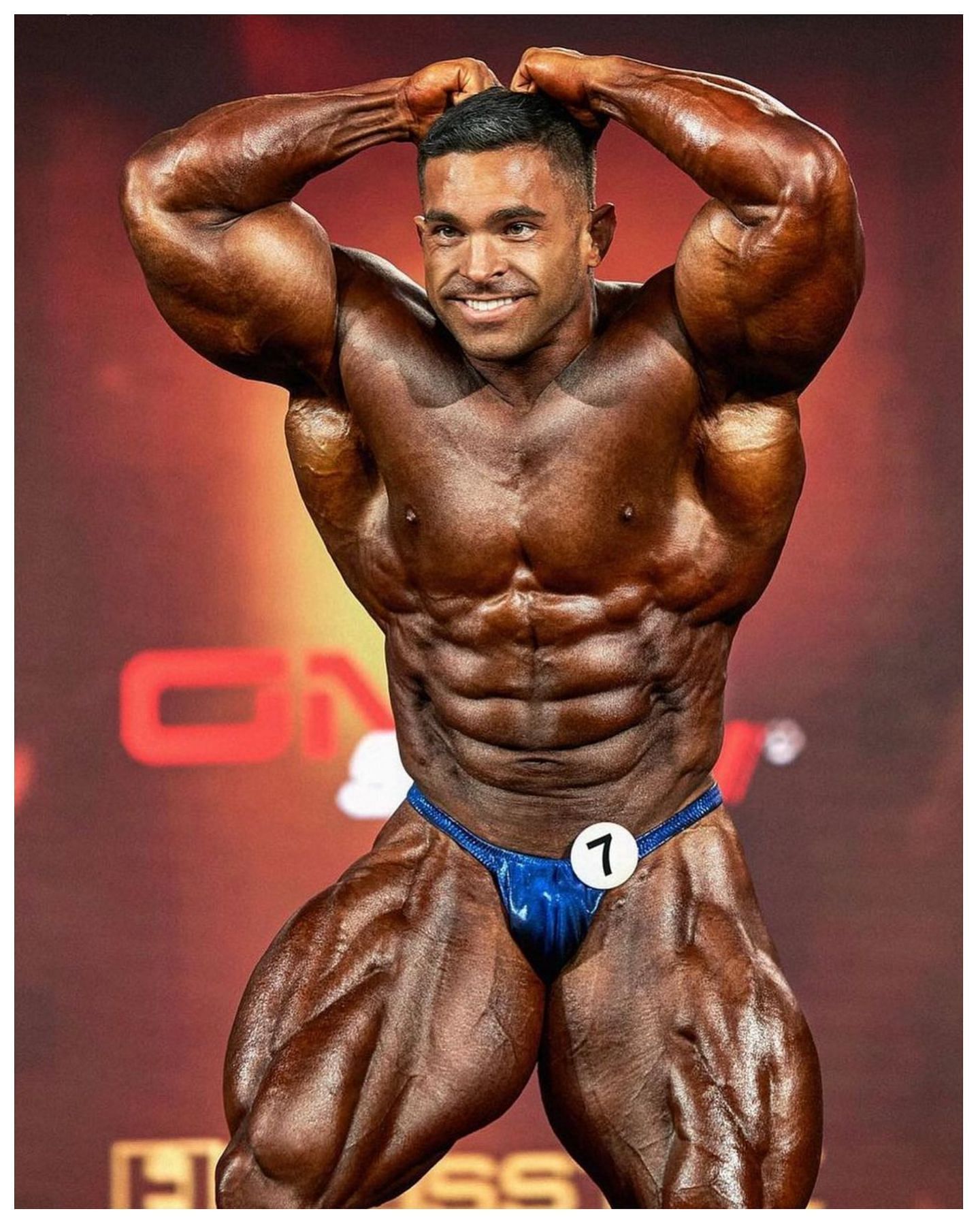 Lunsford poses on stage at the 2022 Mr. Olympia (Image via Instagram/@dereklunsford_)