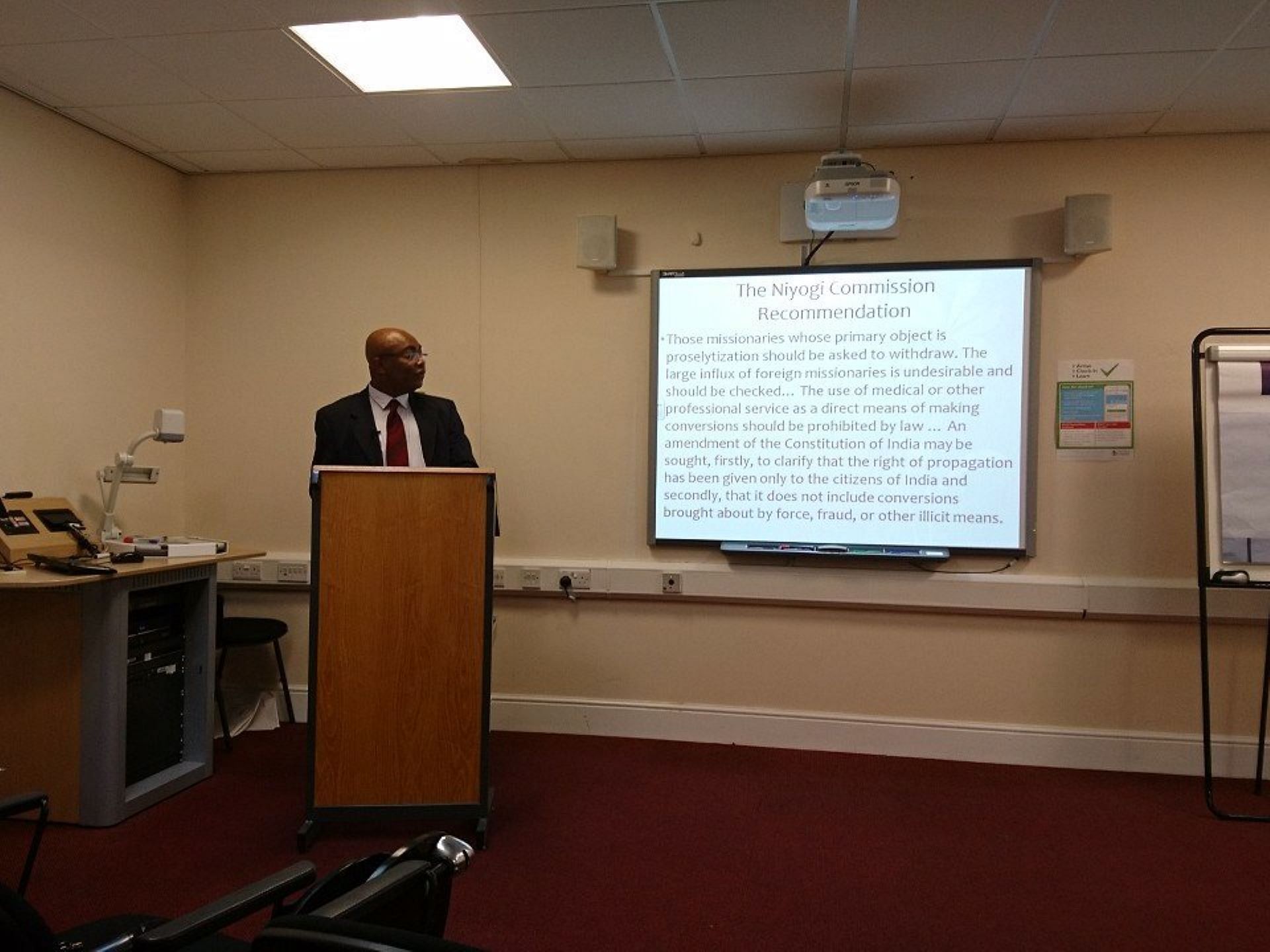 Dr Marinus Iwuchukwu speaking at an academic conference (Image via Twitter/@TRSChester)