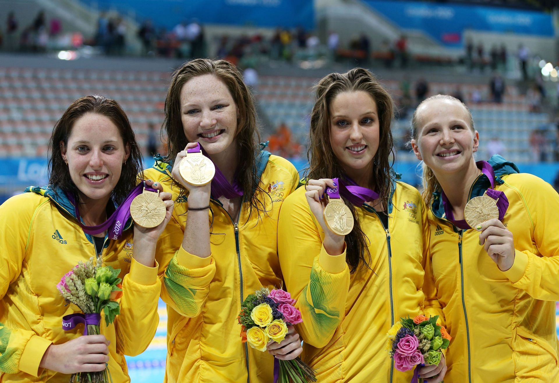 Alicia Coutts, Melanie Schlanger, Brittany Elmslie and Cate Campbell of Australia celebrate with their gold medalis during the medal ceremony for the Women&#039;s 4x100m Freestyle Relay at the London 2012 Olympic Games 