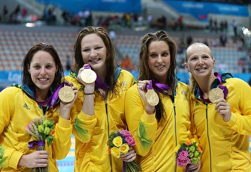 Alicia Coutts, Melanie Schlanger, Brittany Elmslie and Cate Campbell of Australia celebrate with their gold medalis during the medal ceremony for the Women's 4x100m Freestyle Relay at the London 2012 Olympic Games 