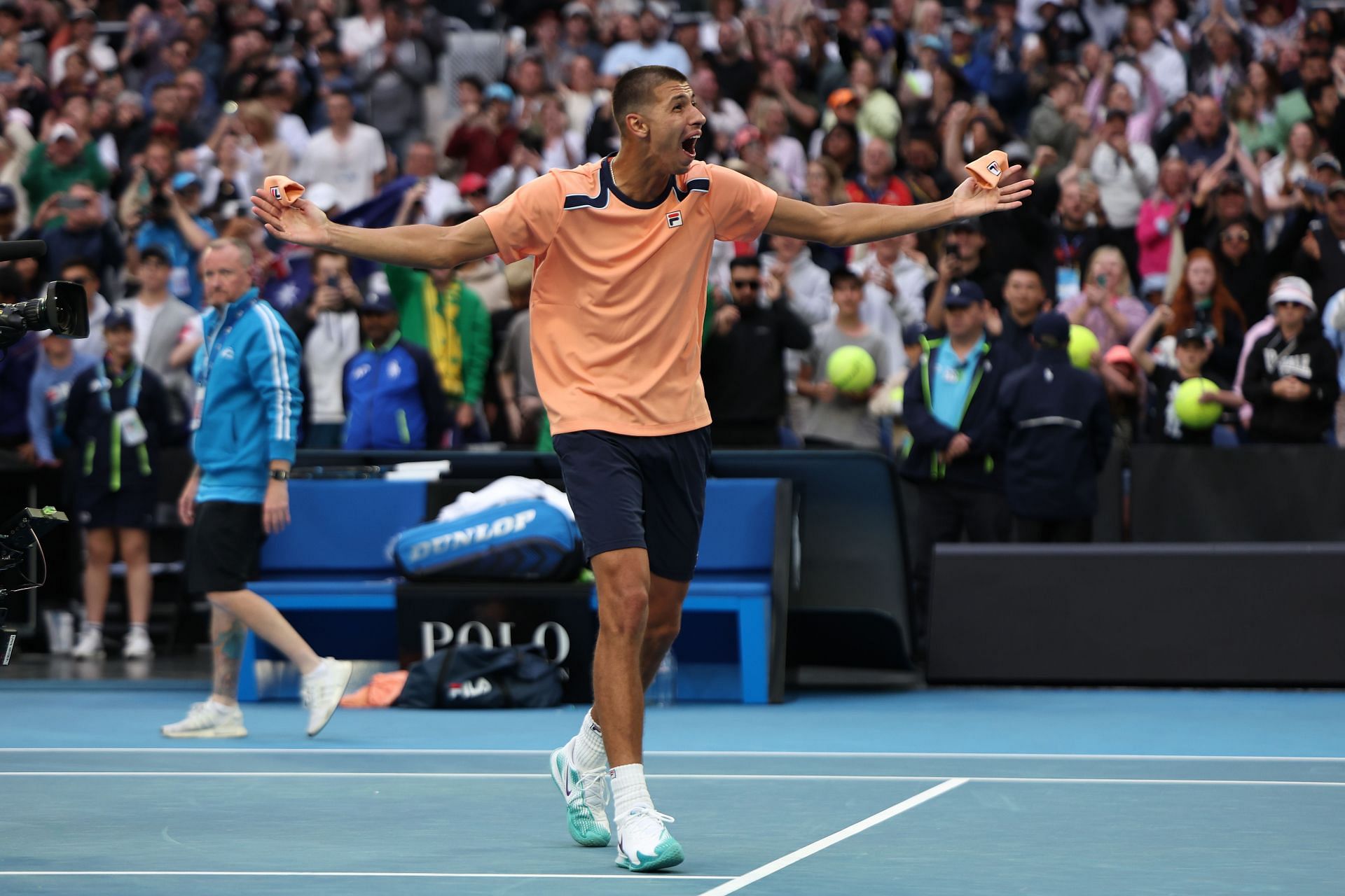 Alexei Popyrin celebrates match point in their round two singles match against Taylor Fritz