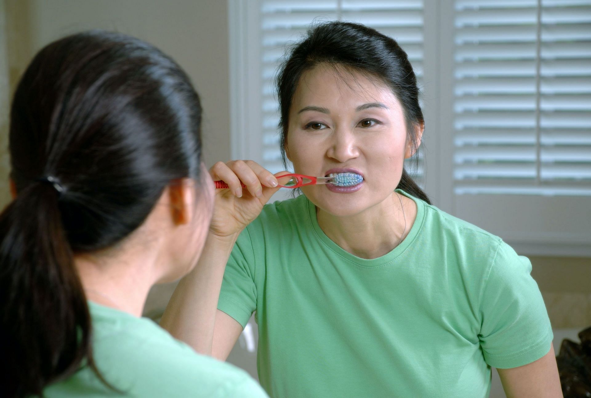 Poor oral hygiene may cause metallic taste. (Image via Unsplash/ National Cancer Institute)