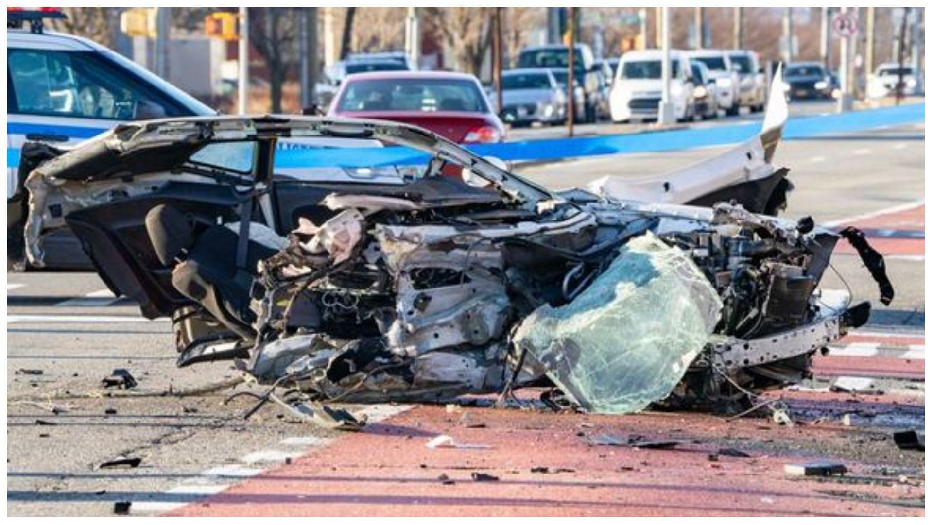 The car slammed into a wall and then crashed into a utility pole. (Image via Daniella Temi/Twitter)