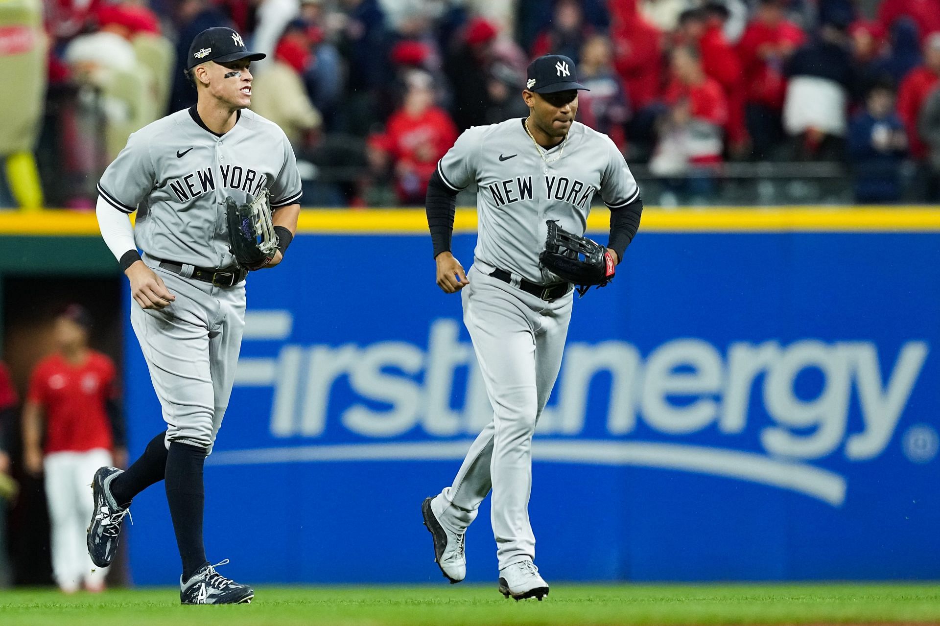 Outfielders Aaron Judge and Aaron Hicks celebrate after defeating the Cleveland Guardians at Progressive Field