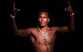 Israel Adesanya flaunts new neck tattoo, asks fans to decode its meaning