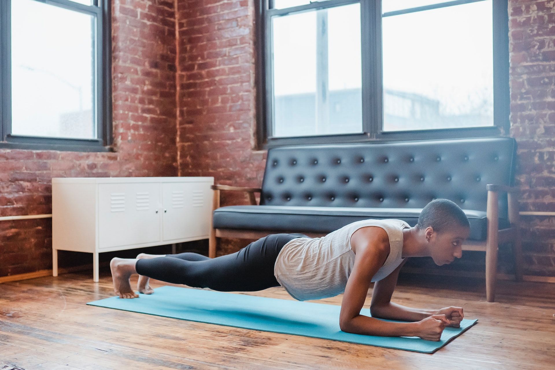 Full-body workouts at home should definitely include a forearm plank. (Photo via Pexels/Photo by Klaus Nielsen)