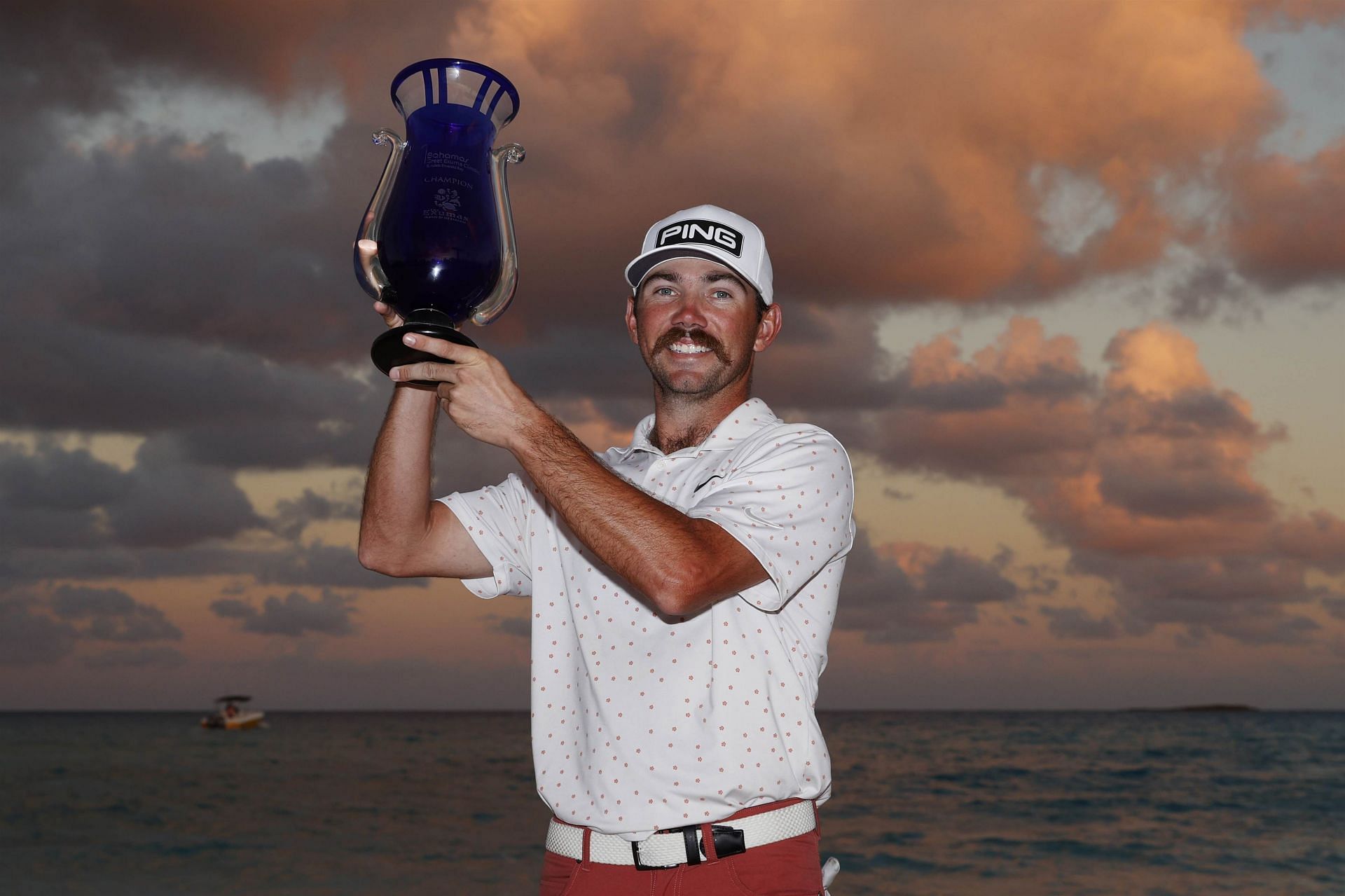 Chandler Phillips lifting The Bahamas Great Exuma Classic trophy