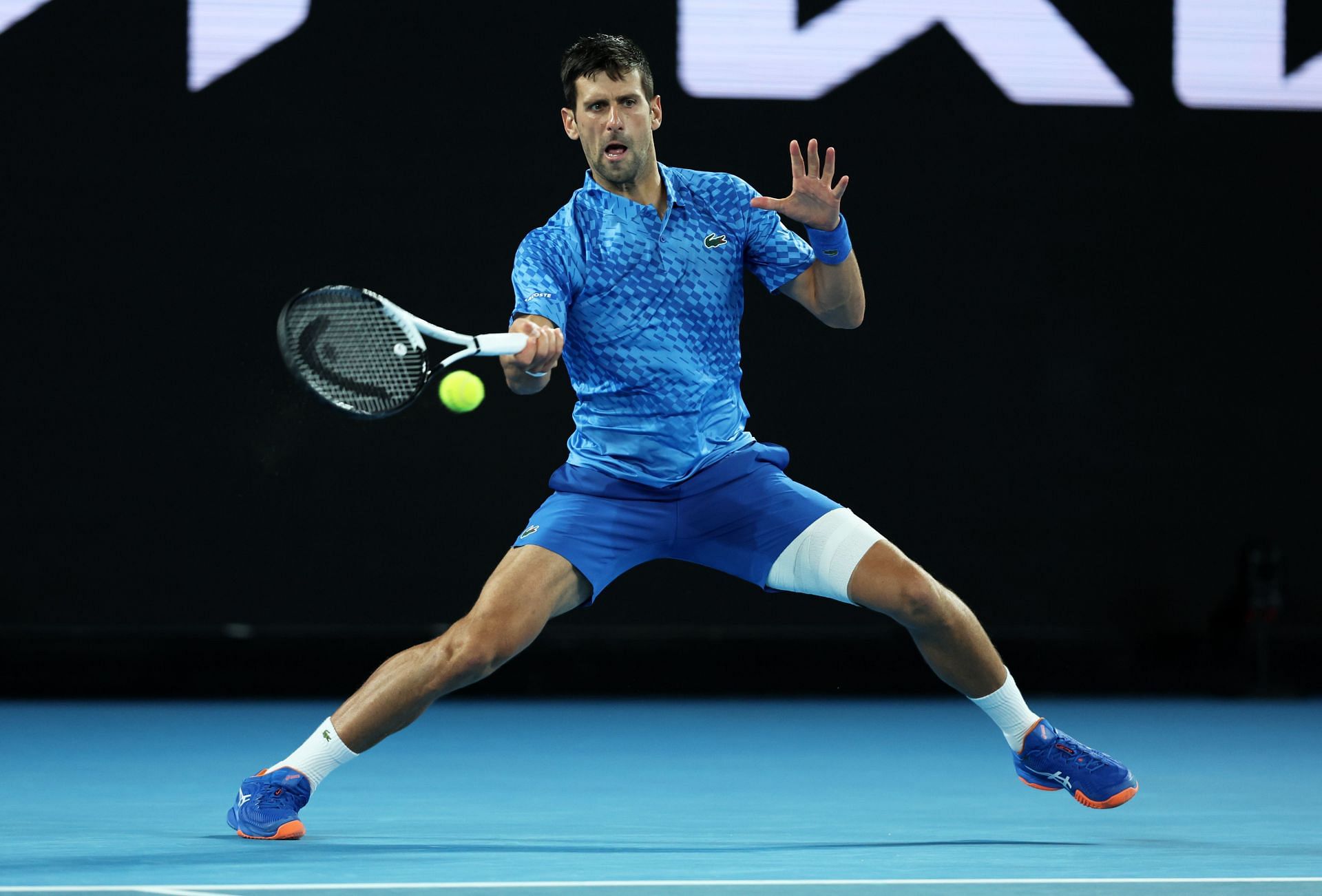 Novak plays a forehand against Roberto Carballes Baena