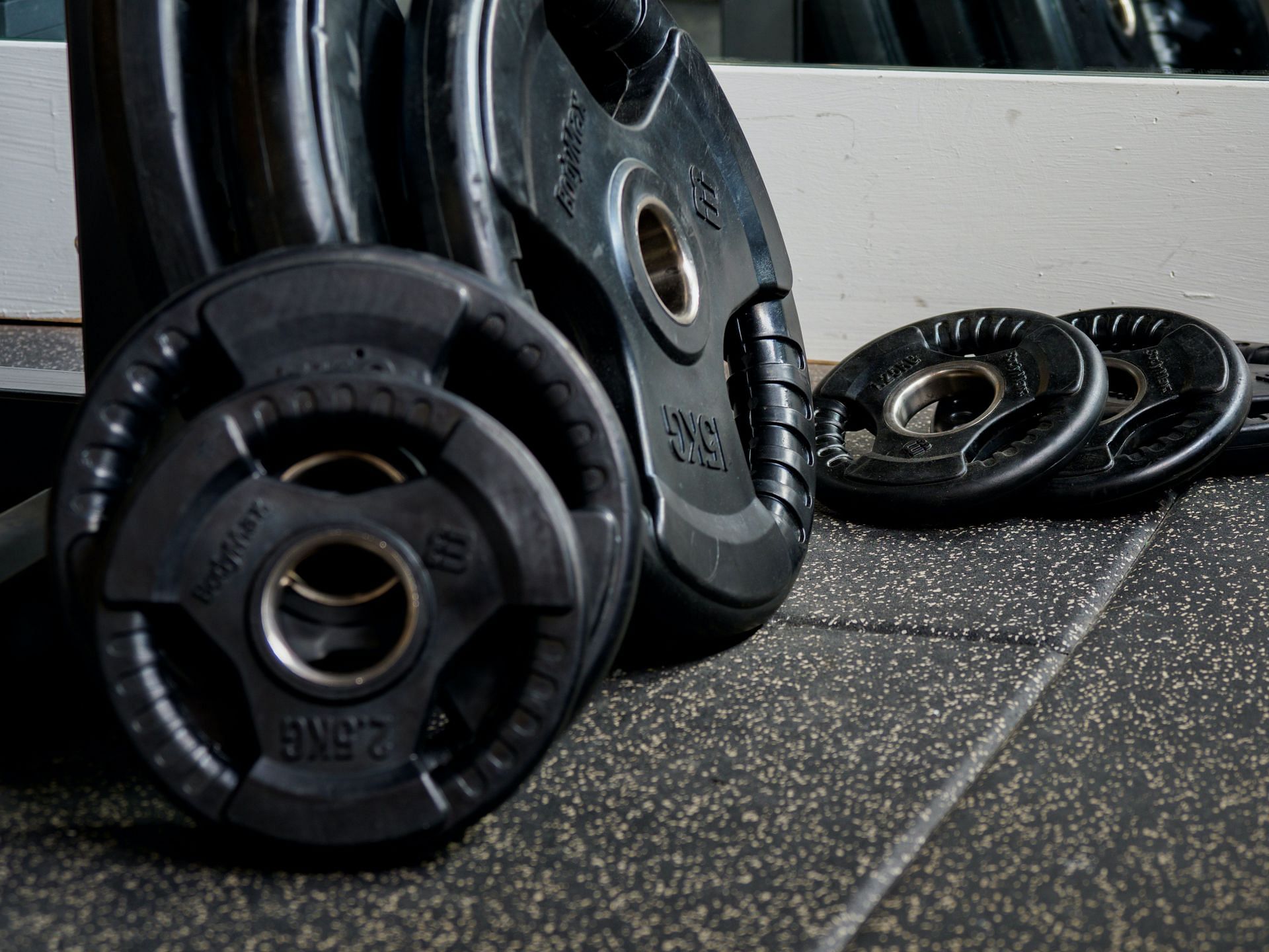 Weight plates are another great option for weightlifting at home. They are relatively inexpensive and can be used to add resistance to your exercises. (Photo by Brett Jordan/pexels)