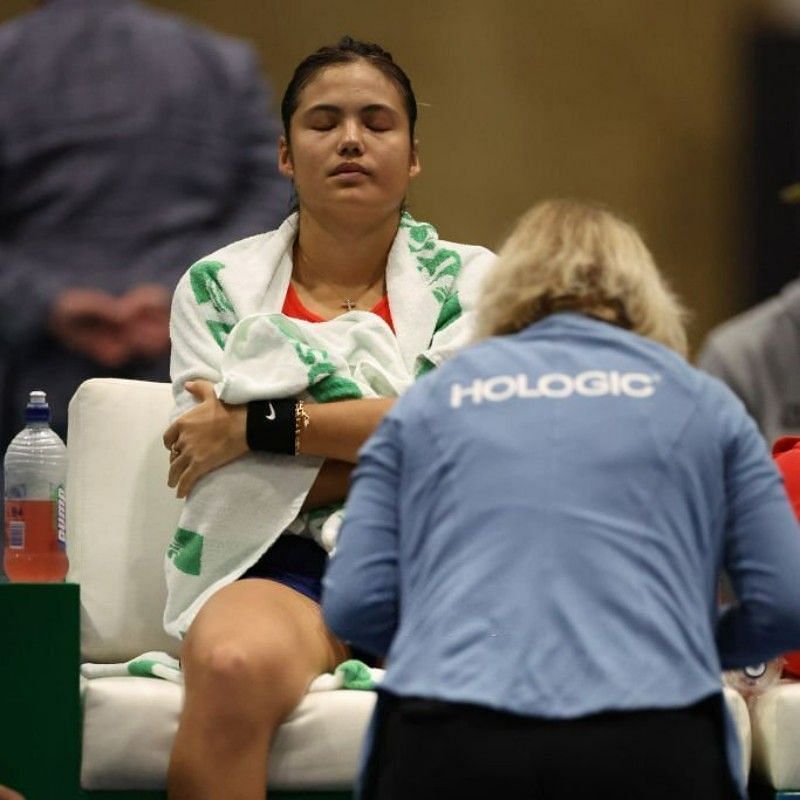 Raducanu undergoes treatment on her left ankle