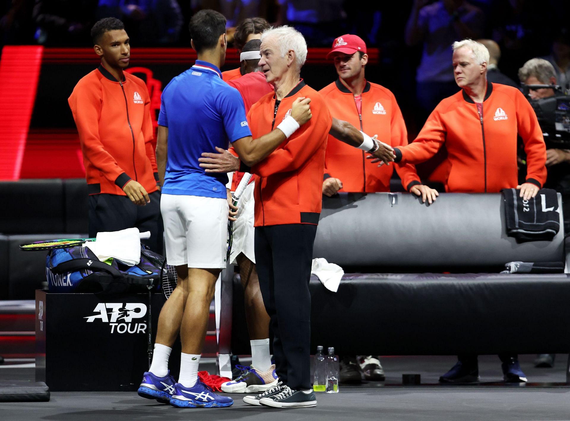 McEnroe greets Novak Djokovic at the Laver Cup 2022.